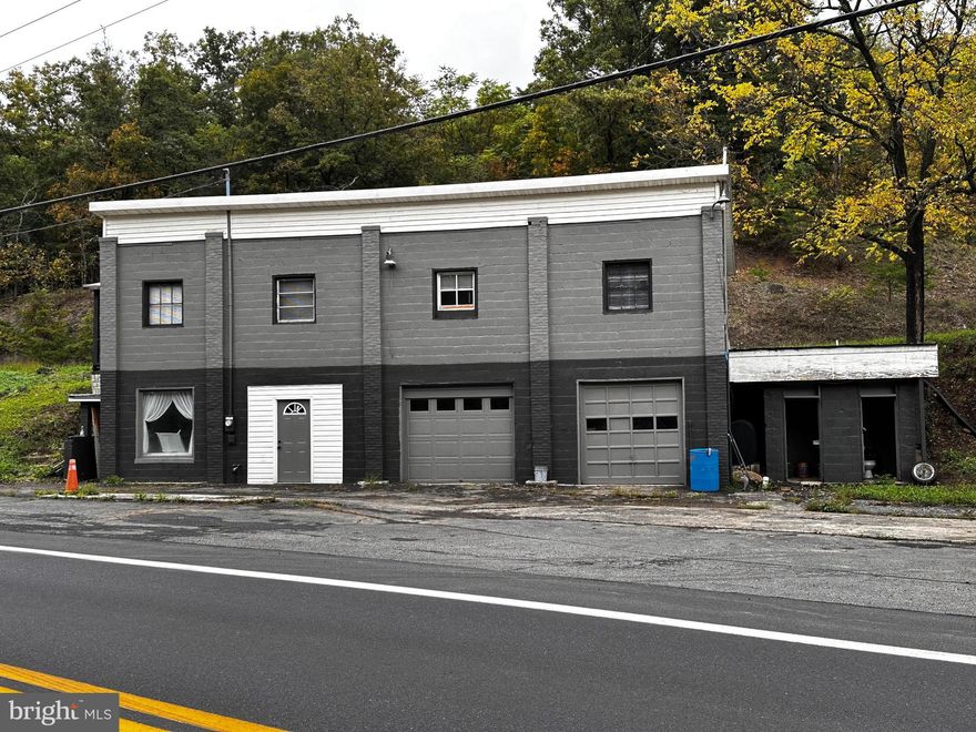 OPPORTUNITY TO COMBINE A PLACE TO LIVE AND A NICE INCOME ON 9.02 “UNRESTRICTED” ACRES. THIS PROPERTY OFFERS A LARGE COMMERCIAL GARAGE BUILDING AND AN OVERHEAD 3 BEDROOM, 1 BATH APARTMENT. NEW PAINTED 100% CONCRETE BLOCK BUILDING WITH METAL ROOF, NEW DOOR, NEW WINDOWS, OFFICE, (2) ½ HALF BATHS (EXTERIOR), PAINT BAY, NEW GUTTERING, (1) 250 GAL. OIL TANK, 300’ ROAD FRONT, PUBLIC UTILITIES AND PRIVATE GRAVEL ROAD.  OVERHEAD APARTMENT FEATURES 3 BR, 1 BA, KITCHEN, LIV RM, FOYER/OFFICE, LAUNDRY, SIDE PORCH & PUBLIC UTILITIES. OLD BLD LOT WHERE M-HOME USED TO BE ALSO INCLUDED.  CALL TODAY.. THIS ONE WON’T LAST!