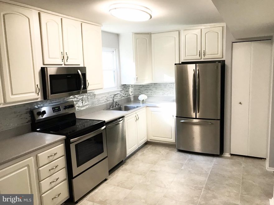 Gorgeous Remodeled Townhome! No expense was spared in upgrading this wonderful home with attention to every detail! Upgrades include dark hw floors, plush carpet, and beautiful tile in basement. Kitchen offers SS appliances, corian counters, custom backsplash and tile floor. Amazing bathroom upstairs showcases masterful tile work and custom dual vanity. Home backs to the woods and walk to pool!