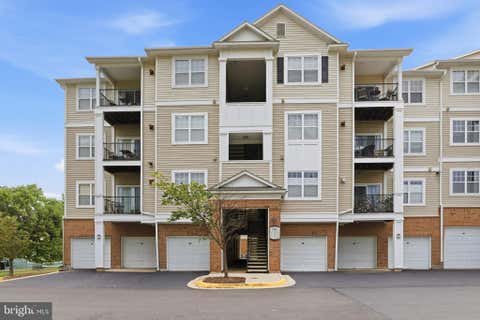 Photo of 19611 Galway Bay Circle #402, GERMANTOWN, MD 20874 (MLS # MDMC2248796)