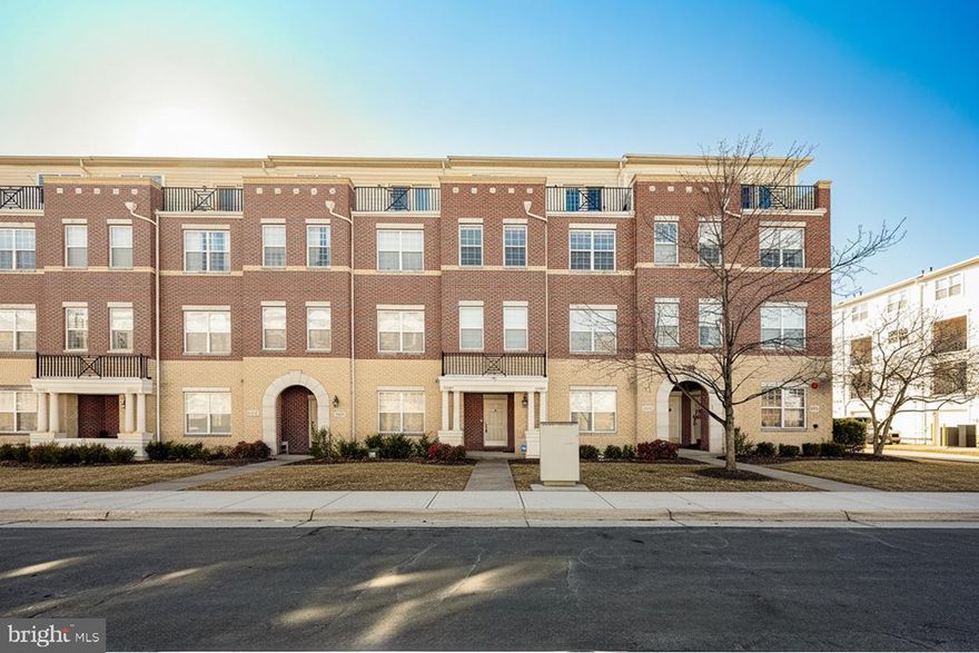 Welcome to the RARELY AVAILABLE, crown jewel of the community, the largest and most stunning model available in sought after Brambleton Town Center, where space, style, and thoughtful upgrades come together effortlessly. This exceptional, 3-level townhouse-style condo offers an impressive 2,766 square feet of beautifully designed living space, featuring 3 bedrooms, 2.5 baths, a one-car garage, and upgrades at every turn.

The main level showcases elegant floating LVP flooring and a versatile den that works perfectly as a home office, library, or flex space. At the heart of the home is a huge gourmet kitchen, complete with granite countertops, rich cherry cabinetry, and an expansive layout that flows seamlessly into a sun-filled breakfast area. Step outside to the covered balcony for morning coffee or evening unwinding.

Upstairs, the expansive primary suite feels like a private retreat, complete with its own balcony and a luxurious en-suite bath featuring a double vanity, separate shower, and soaking tub. Two additional generously sized bedrooms provide comfort and flexibility for guests or family.

The homeowners have elevated this already gorgeous home with high-end additions, including custom Closet America closets installed in 2022, built-in custom garage shelving, new ceiling fans, and smart home touches. Major system updates offer peace of mind, including a new roof in 2025, new HVAC in 2023, and a new refrigerator, washer, and dryer in 2023. The Nest thermostat conveys, along with all garage shelving built-ins.

Ideally located with easy access to Loudoun County Parkway, Routes 50 & 28, and Ashburn's Silver Line Metro Station. The low condo fee covers all of Brambleton’s amenities, including multiple pools, sports courts, a fitness center, tot lots/playgrounds, jogging/walking paths, and more. Plus, Verizon Fios cable and internet are included! 

This gorgeous home delivers rare space, exceptional upgrades, and everyday convenience. Simply put, this is the standout residence in the community, refined, spacious, and truly turn key, move-in ready! ***Open House on Saturday, Feb 7th from 1-3pm, and Sunday, Feb 8th from 10am-12 noon. You do not want to miss this stunning townhome! ***