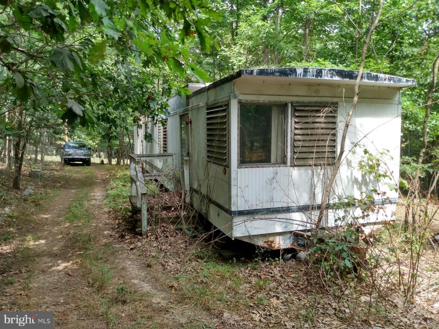 Almost 6 Acres of unrestricted mountain land in Almost Heaven WV,  great for hunting, hiking, 4 wheeling, or building that long awaited mountain get-a-way. Old mobile home is considered of no value and the sales price has been adjusted accordingly. Come out for a look today!