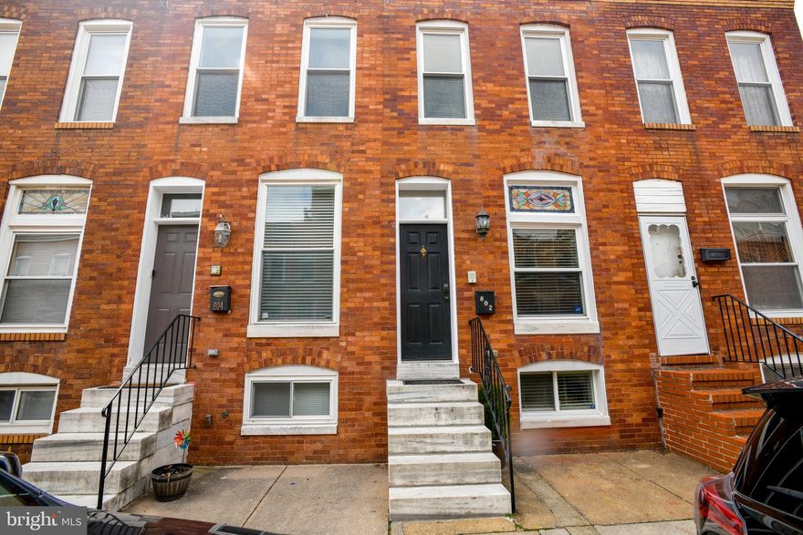 Welcome home to your 3 bedroom, 2 bath Canton Rowhome with one car parking just blocks from Canton Square and the water.  This home combines the charm and character expected of Baltimore rowhomes with all of the modern touches one comes to expect.  The main level has an open floorplan with hardwood floors. The living room has the classic brick accent wall, a stained glass window above the front door, crown molding, built in ceiling speakers and an intercom system. The gourmet kitchen has stainless steel appliances, granite counters and tons of cabinets. On the 2nd level you will find two ample sized bedrooms with ceiling fans, the stackable washer/dryer, and the renovated hall bath with tiled shower.  The lower level has the 3rd bedroom or recreation room and the 2nd full bathroom with tub/shower combo.  The one car parking and proximity to the Safeway and Canton Square are conveniences that you will appreciates living in Canton!