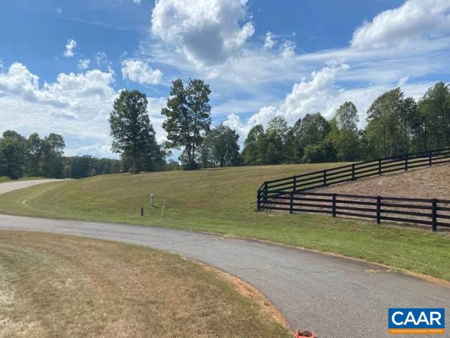 Building lot in desirable community ready for your dream home.  Lot has been cleared with driveway and  well & pump installed.