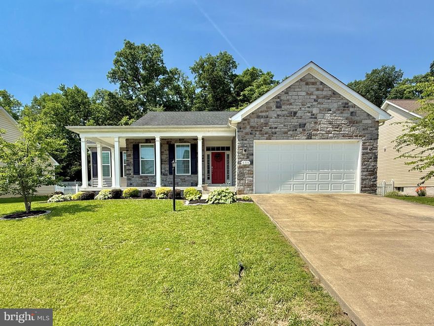 If you need everything all on one level this stone front beauty is for you.   Inviting front porch is perfect for enjoying your morning coffee.  Open living, dining,  kitchen area is ideal for entertaining.  This home has the split bedroom design with the primary bedroom separate from the additional two bedrooms.  Although this home has a full unfinished basement the laundry is conveniently located on the main living area.  The living room has a cozy gas fireplace perfect for those cold winter evenings.  The primary bedroom has tray ceilings and a roomy walk in closet.  The primary bath is huge with double vanities, walk in shower and even a soaking tub.  The huge basement is ready for your imagination and includes a walk out to the back yard.  The deck off the living area is ideal for sitting, grilling and watching nature in the woods behind the backyard.  Don't wait to make your appointment for this one!