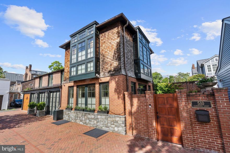 Welcome to 510 Hammonds Court, a beautifully transformed 1850s historic property, now a modern home filled with thoughtful custom designs at every turn.    Located in the heart of Old Town between two private alleys, this charming Carriage House is just steps away from the heart of King Street and its shops and restaurants.  3 bedrooms & 2 Full bathrooms on the upper level, plus a third full bathroom and built in Murphy bed/guest suite on the lower level.  Lower level rec room also boasted an extensive wine bottle wall system and built-in beer tap with perlick system.   Newly renovated gourmet kitchen includes a La Cornue stove, dining area with double sided fireplace and dual archways that lead into the light-filled living room.  Hardwood floors throughout, high ceilings, custom draperies, and special detail.  Numerous French doors create an indoor/outdoor living environment with the living room doors opening to a private bluestone patio featuring a tranquil water feature.   2,400 square feet in total, garage parking and surface parking.  A one of a kind home, a true treasure in Old Town with an unbeatable location.  Be sure to visit the 3D Tour!