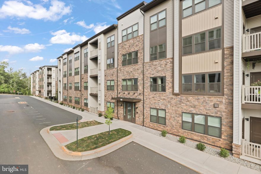 Welcome to Loudoun View!  This 2-bedroom, 2-bath condo offers 1,122 square feet of modern living in a community built in 2023.  Designed with an open-concept layout, the home is ideal for both everyday living and entertaining.  The gourmet kitchen features stainless steel appliances, quartz countertops, and a large island that flows seamlessly into the living area.  The spacious owner's suite includes a luxurious ensuite bath, while the second bedroom - perfect for guests or a home office - is set apart for privacy with easy access to the hall bath.  Enjoy a composite deck with views of the pool, plus $4,800 in custom Roman shades and drapes.  Additional conveniences include a full-size washer and dryer, reserved garage parking, and a secured building entry system that can be monitored from your phone.   Community amenities include a pool, pickleball court, basketball court, brand-new playground, and open green spaces - all with a low monthly condo fee of just $264.  Perfectly located, Loudoun View is just a stone's throw from Cascades Overlook, offering Harris Teeter, restaurants, a pet store, and boutique shops.  Nearby retail includes Costco, Target, and Home Sense, while the Claude Moore Rec Center offers indoor pools, a spacious gym, indoor walking lanes, and outdoor trails.  easy access to Route 7, Fairfax County Parkway, and Dulles Airport makes commuting to Reston, Tysons, and Washington, D.C. a breeze.