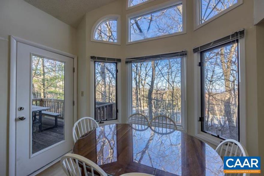 Seasonal Mountain Views, Top Floor and many upgrades in last 2+ years! Bright and Open with Cathedral Ceiling,  New Carrier HVAC system (2021), New Appliances in Kitchen (LG Stack Washer/Dryer), Stove, Dishwasher, New Durable wood-like Laminate in Living Room/Dining Room. NEW WINDOWS to be installed in about 6-7 weeks (PD BY SELLER).  The Kitchen Cabinets were Freshly Painted White to reflect a Modern look of today!  ALSO, a new Picnic Table on Back Deck for relaxing, w/ friends/family after a day of skiing/hiking/visiting wineries/breweries or exploring Blue Ridge Parkway! Both 1st and 2nd floors  offer Master Bedroom Suites. This unit is Conveniently located on the Shuttle Bus route, and only a Few Steps away from the Wintergarden Spa & Aquatics Center, Nature Foundation, Devils Grill Restaurant, Golfing, Tennis and Hiking Trails. Association provides firewood!! Turn key and Tastefully Furnished .. Move-In Ready! Fall & Winter Activities right around the corner!,Formica Counter,Oak Cabinets,Fireplace in Living Room