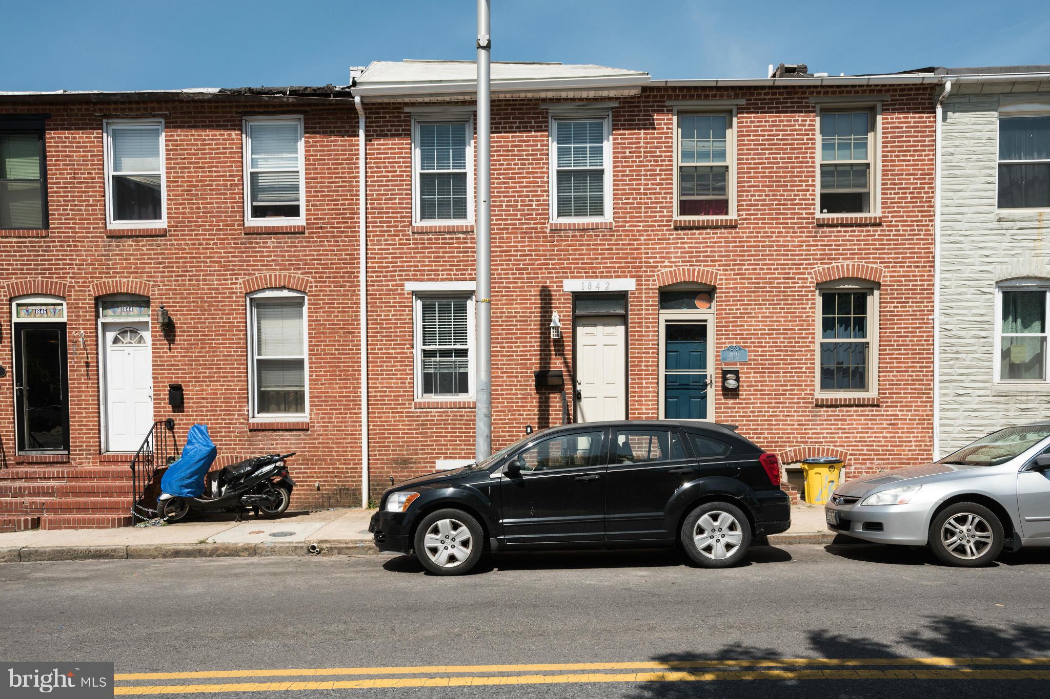 SPECTACULAR FED HILL HOME W/PARKING! THIS BEAUTY BOASTS 4 BEDROOMS, W/ 2 OWNER SUITES &3 F/BAs. GLEAMING HARDWOODS &TILED BAs, EXPOSED BRICK IN LR,EAT-IN KIT W/GRANITE COUNTERS &SS APP & CABINET SPACE GALORE! SPACIOUS 2ND LVL OWNERS SUITE W/ EXPOSED BRICK &VAULTED CEILINGS! FINISHED BASEMENT W/ BEDROOM& FULL BATH. ROOF TOP DECK SUPPORTS ARE INSTALLED AND READY!