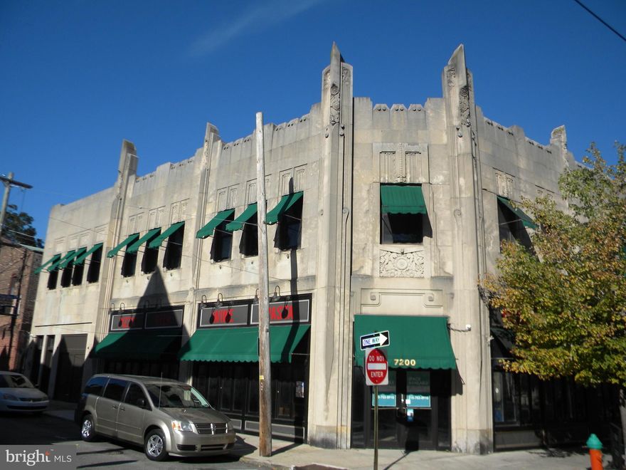 Boasting a distinctive Art Deco spired-crowned facade, this mixed-use investment property is a landmark in Mount Airy’s vibrant business district. Offering two retail units and nine one-bedroom apartments, this 2-story stucco/masonry building is a prime investment. One commercial unit is leased to a beverage retailer. The other commercial unit is vacant and was last occupied by a restaurant tenant. The nine apartments with separately metered utilities have full kitchens, C/A, many skylights, mostly hardwood floors, &  coin-operated washers & dryer.  The gross operating income includes the prior tenant's rent for the vacant commercial space.  The "Tourison Building" (developed by Sedgwick Tourison in 1929) was originally the "White Swan Hotel" and is registered by both City and State as architecturally significant.