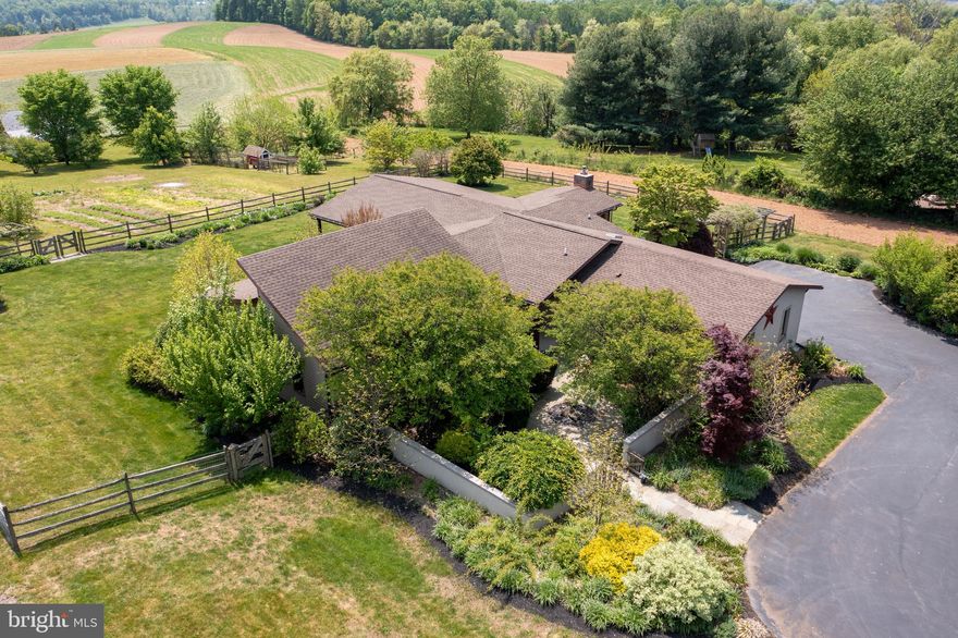 This contemporary ranch-style home in the Lampeter Strasburg school district is not only beautiful but also energy-efficient with geothermal heat. Vaulted ceilings, cast concrete countertops, and a sub-zero refrigerator are just a few of the high-end features of this stunning property. Cozy up next to the gas fireplace or relax on the large covered deck with a tranquil water feature and take in the expansive farm views. This homestead includes fruit trees, berries, vegetable gardens, and a chicken coop, perfect for sustainable living. With 3 bedrooms, 2 full bathrooms, and a reconstructed historic log cabin with an authentic feel, this property has it all.  Don't miss out on this unique and energy-efficient property!  ***Open House on SATURDAY, May 13 from 1:00 to 3:00 PM***