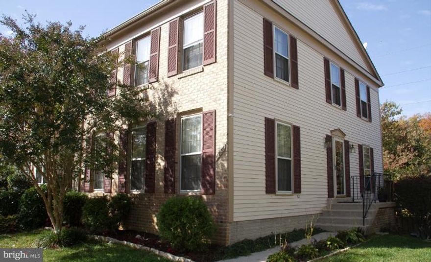 Very Spacious End Unit backs to spectacular view all year around. Hardwood floors on main level , Separate dining room and large living room. Skylights, large double deck. Fully finished walk out basement with bonus room or (4th BR) & full bath.  Close to 2 Metro stations,major roads and shops.