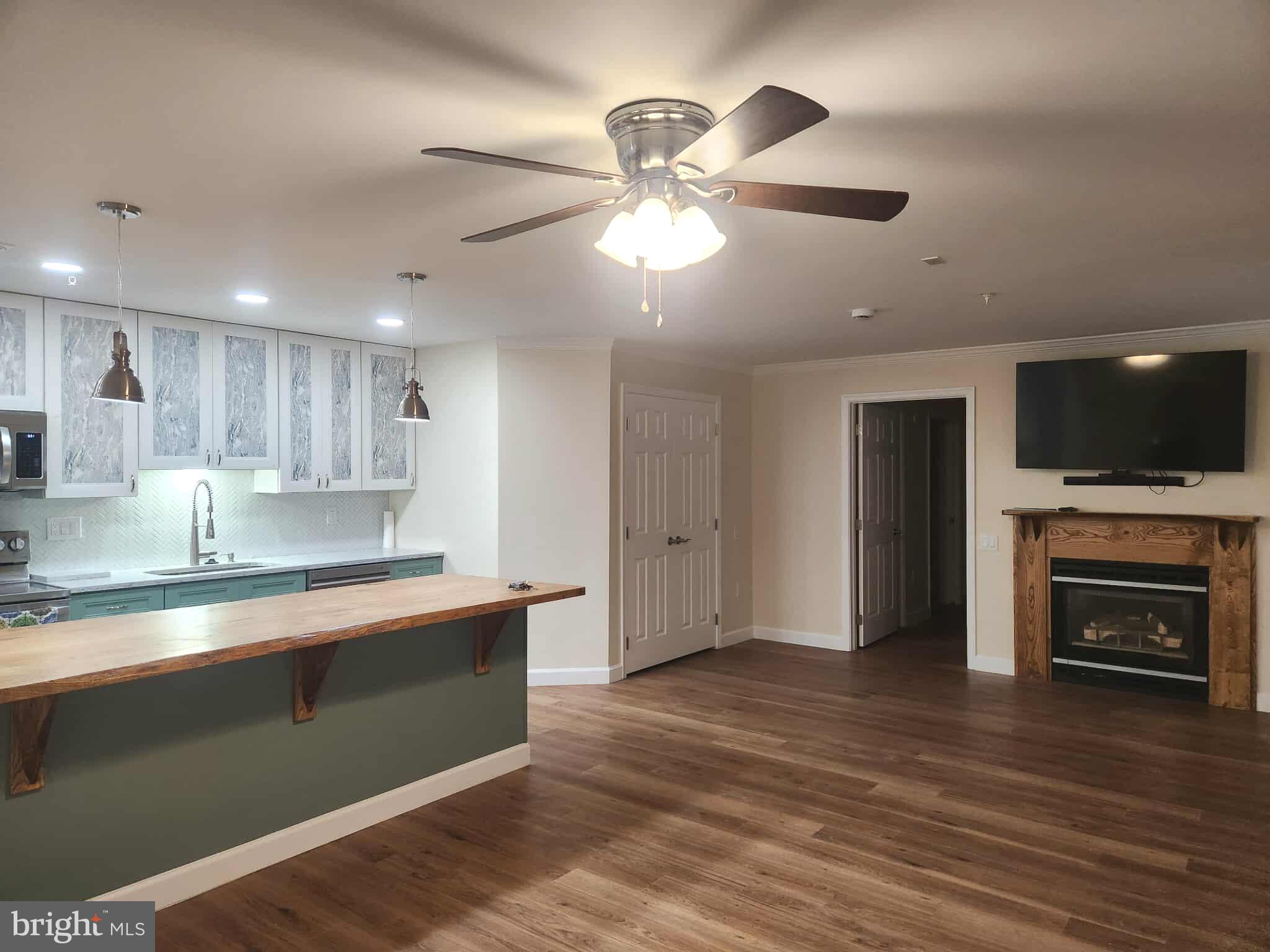 Beautiful and completely renovated main level condo. Spotless!!! Bright, open floorplan, huge island with overhang for stools, new appliances, and luxury vinyl plank floors throughout. Main level front door entrance, plus door to patio and door to walkway from primary bedroom. Primary bathroom has huge walk-in shower, rain shower head plus hand-held shower head. Primary bedroom is very spacious with bay window/door and huge walk-in closet. Secondary bedroom is generously sized with double windows, closet, and adjacent full bath. Several ceiling fans throughout. Lovely gas fireplace with mantel. Gorgeous white cabinets including pantry, quiet-close doors and drawers, and pull-out shelves. New stainless-steel appliances, plus washer and dryer. Tenant will have access to all amenities, including pools. This unit was retrofitted to be fully ADA compliant and handicap accessible - RARE, hard to find! Available immediately. 12-month lease (or longer) plus security deposit required. Pets are considered on a case-by-case basis and are subject to breed and size restrictions imposed by the Condo Association. Tenant must submit to employment verification or proof of funds if not employed, credit check, and application. Tenant pays all utilities; owner pays the HOA/Condo fee. OPEN HOUSE THIS SUNDAY SEPTEMBER 7th from 11 - 1 for potential tenants. Hurry, won't last long!