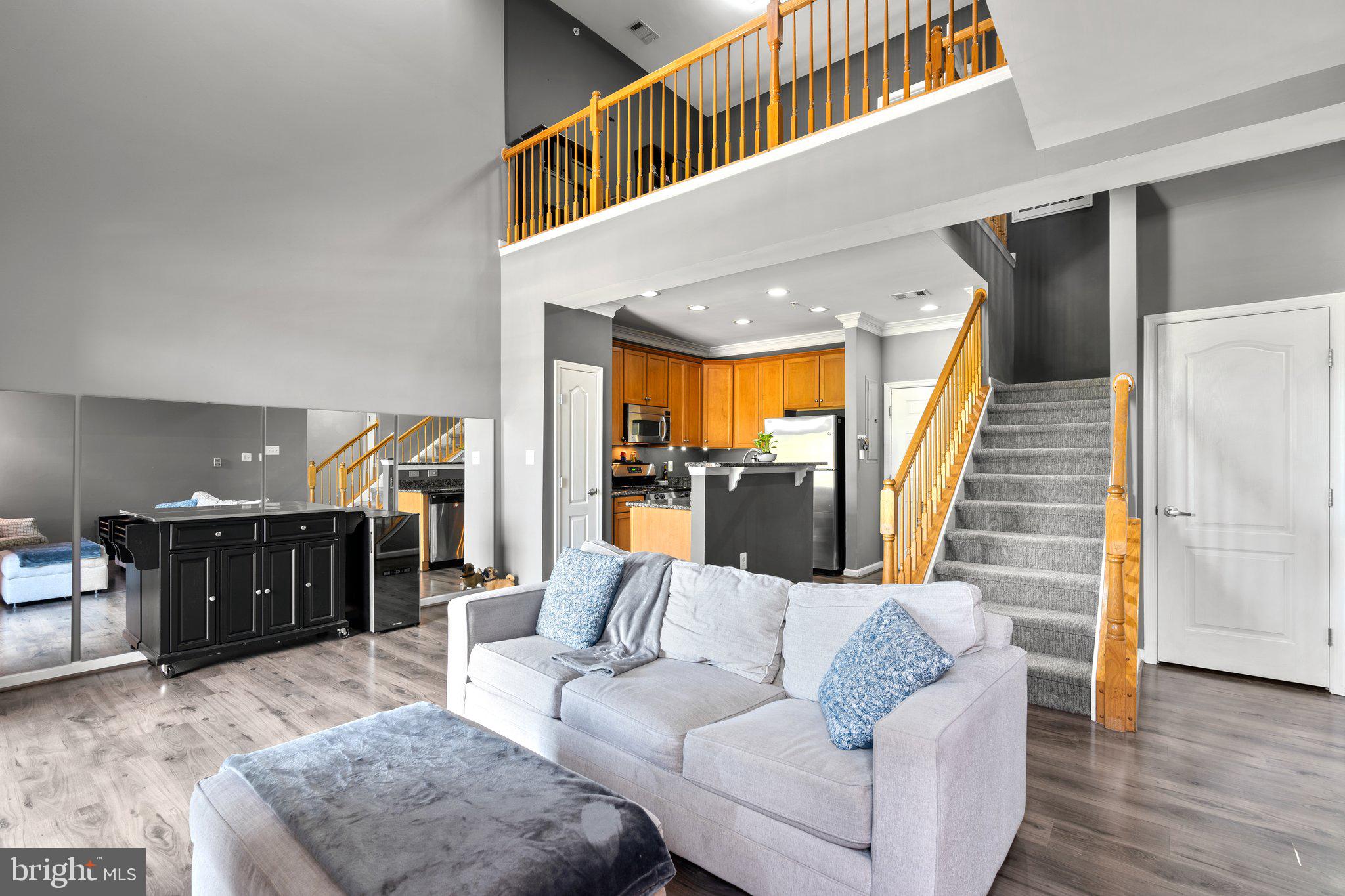 Stunning 2-Level Condo in the Heart of Lorton Station – Perfect Blend of Comfort & Convenience!
Welcome to The Residences of Lorton Station! This unit is priced to sell , offering more space and updated features than similar units in the area at a competitive price. Seller is motivated to facilitate a quick closing process.
Ideal for commuters and first-time buyers – with easy access to public transport, no need for a home security system, and excellent walkable dining, this condo is a dream come true.
This spacious 2-bedroom, 2-bathroom condo offers a bright, open floor plan with soaring two-story ceilings in the living area, which opens to a loft space – perfect for an office, den, or reading nook!
The open-concept kitchen is a chef's dream, featuring granite countertops, stainless steel appliances, and plenty of space for meal prep. Step outside to your private balcony, complete with an additional storage closet, perfect for outdoor gear or seasonal items.
This unit offers more usable living and storage space than other condos in the building, with generous room sizes and walk-in closets in both bedrooms. You'll love the extra-large storage closet under the stairs, ensuring that clutter is never a concern.
The primary suite features a large en-suite bathroom with a separate shower and garden-style soaking tub for a spa-like experience. Plus, enjoy the convenience of a separate laundry room with a full-sized washer and dryer along with custom shelving and more storage space, just steps from the primary bedroom.
Key updates include a brand-new HVAC system (replaced in September 2024), new water heater with expansion tank (replaced in April 2024), a recently replaced roof and camera security system (by the condo association in 2025) ensuring peace of mind for years to come. Recently updated with fresh paint throughout and modern, energy-efficient light fixtures to create a welcoming, contemporary vibe.
This home also includes an assigned tandem parking space (#16) for two vehicles, a large storage cage (approx. 4'W x 10'D x 8'H) located in the storage closet down the interior hallway, and custom-made vertical blinds that convey with the sale.
Highlights and Amenities:
Pride of Ownership: The current owner has meticulously maintained and updated the home, with documented records of all owner's manuals, paint colors, and warranties, all of which will be transferred to the new owner, ensuring a seamless transition and peace of mind.
Well-maintained building with a strong condo association that’s invested in the property’s long-term upkeep.
Monthly condo fee includes water, sewer, and trash utilities in addition to the standard maintenance for all shared spaces, landscaping, and community amenities.
The average monthly cost for gas, electric, and internet is approximately $285, offering a great value on utility needs for the space.
Enjoy the Lorton Station Community Pool and Clubhouse, just a short stroll down the street.
Take advantage of the Lorton Station Town Center, offering dining options like Casa Tequila Bar & Grill, Vocelli Pizza, Great Harvest Bread Co, Lasani Kabob, and The Wine Attic – all right outside your door!
For commuters, the Virginia Railway Express (VRE) station is just across the parking lot, providing a direct route to Crystal City and a seamless connection to the Metro for easy access to downtown DC.
Don’t miss out on this move-in ready condo, combining the best of modern living with unbeatable convenience. Schedule your showing today!