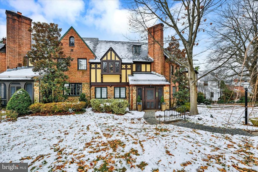 Lovingly restored impressive stone Tudor featuring 4 bedrooms, 3 full baths and 2 half baths spread across four gorgeous levels. Prominently placed in the center of Original Northwood, every detail of this home has been examined and improved upon by the current owners. A winding path leads you to the enclosed front porch, then inside the entry foyer with direct access to the spacious dining and living rooms. A wood burning fireplace with Craftsman mantelpiece anchors the living room, complemented by 3-wide mulled windows providing generous natural light. Gorgeous moulding and decorative windows are also featured in the dining room and adjoining breakfast room, both of which offer French doors for form and function. The kitchen is an absolute masterpiece in design, style and craftsmanship. Think natural stones, glass front cabinets, Marvin windows, two sinks, stainless steel appliances, coffee bar and decorative shelving. The second floor features three bedrooms and two baths with an en suite in the primary bedroom and a Jack and Jill bathroom providing privacy for the other two bedrooms. The third floor sanctuary offers a bedroom with en suite bathroom and large walk-in-closet. The lower level adds plenty more living space with a cozy family room with fireplace and large storage/utility room with washer/dryer, half bath, shelving and egress to the back porch. Out back, you will find a stunning courtyard-like setting with a brick patio and path to the detached 2-car garage. Original hardwood floors, leaded glass windows, decorative moulding and tasteful color palette complement the historic nature of this special and unique home. The owners have carefully invested in the major systems of the house so you won’t have to. This includes a new boiler/heating system, central air conditioning, ductless a/c (third floor), water heater, copper gutters and more. Conveniently located near shopping, restaurants, Morgan State University, Good Samaritan Hospital and some of Baltimore’s finest walkable neighborhoods.