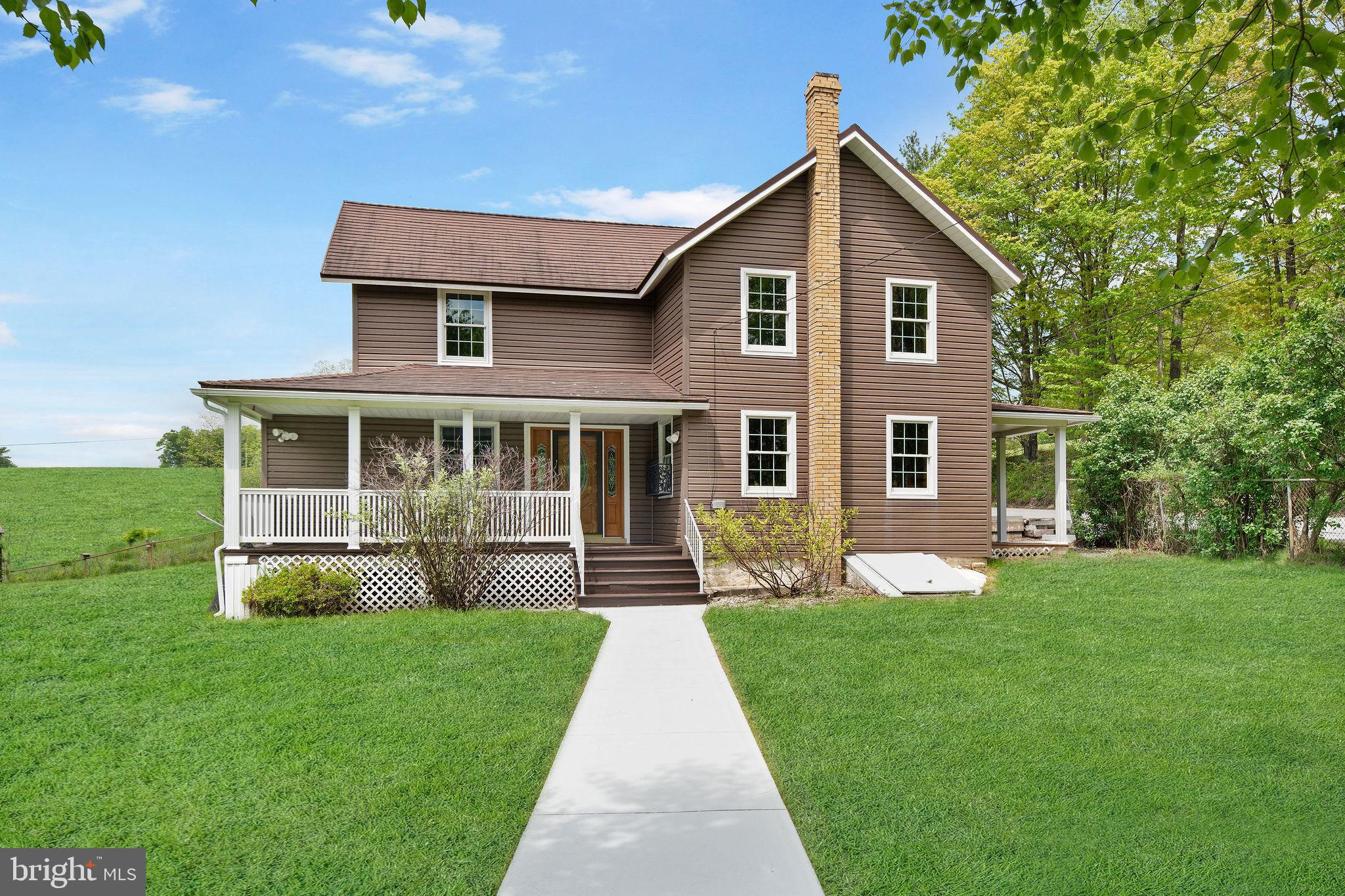 Country living at its best! sitting on 3.96 acres, this private 3-bedroom, 2-bath home offers peace and charm in a serene rural setting. Enjoy relaxing on the spacious porch, taking in sweeping views of pastureland and farms. Inside, you'll find beautiful hardwood floors, a custom-built kitchen, and rich oak interior shutters that add warmth and character throughout. Energy efficiency is a standout feature with solar power to help with electricity costs, a Generac generator for backup, and geo-thermal heating and cooling, along with oil hot water heat for added reliability. This home combines rustic comfort with modern sustainability, truly a rare find.