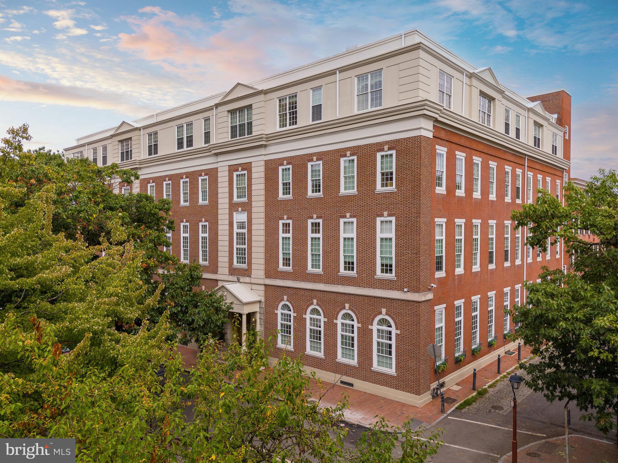 Welcome to The Willings At Independence Park, a 4-story boutique luxury condo building in Society Hill with only 23 residences. Step into The Sedgwick Manor, Residence 404, a space that beautifully balances luxury and livability in this 2-bedroom, 2.5-bath bi-level condo on the top floor. Take the elevator up to the fourth floor, as you enter The Sedgwick Manor you’re greeted by a spacious foyer that highlights the spiral staircase and the bright bay window sill in the living room. To your right, you’ll find a convenient half bath and closet. To your left, the modern kitchen awaits, featuring granite countertops, stylish white cabinets, and stainless steel appliances—a chef's dream! Natural light floods through the tall windows into the expansive living room, accentuating the 14-foot soaring ceilings that create an inviting atmosphere perfect for entertaining. The beautiful oak wide plank flooring adds warmth and elegance throughout the space. The generously sized primary bedroom is adjacent to the living area, complete with an en-suite bathroom and a spacious walk-in closet. Head up the spiral staircase to discover the second bedroom, which can be closed off for privacy or enjoyed as an open loft overlooking the living room. This bedroom features an en-suite bathroom and a large walk-in closet. You will also find the washer and dryer on this level. For added convenience and security, the building offers a 24-hour doorman, ensuring peace of mind at all times. This residence includes ONE CLIMATE CONTROLLED STORAGE UNIT #23! Don’t miss the opportunity to call The Sedgwick Manor at The Willings at Independence Park your new home! Located in a historic neighborhood, surrounded by green spaces such as Independence Park, Washington Square, and the upcoming 11.5-acre park from the I-95 capping project. Enjoy being close to restaurants, cafes, and within walking distance of Center City. Easy access to all major highways and bridges. Schedule your appointment today!