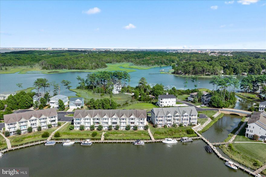 Fabulous waterfront property back on the market, offering exceptional value, incredible features and a chance to own to own a standout property at an attractive price!  Excellent opportunity to wake up to water views at! Lovely large townhouse located on the Glen Riddle Marina with spectacular views in the prestigious gated Glen Riddle community. Enjoy resort style living in this updated 3-bedroom freshly painted townhouse, water views from all windows in the home, 2 decks and patio overlook the marina. The bright gourmet style kitchen boasts gorgeous new granite counters, new 36" radiant cooktop, new SS microwave, SS appliances, hardwood flooring and pantry.  Hardwood flooring and 9’ ceilings on the first floor shows off the large open space living area. Updated large ensuite featuring soaking tub and freshly renovated stylish walk-in shower stall. Walk out spacious lower level with new luxury vinyl flooring, 9’ ceilings. This well-maintained home with one owner, never rented, has 2 zone HVAC units.  Don’t miss this fabulous home conveniently located to Ocean City, Maryland (6miles), Assateague beaches minutes away, restaurants and outlets close by. Numerous amenities such as Club House with a Huge Pool, Gym, meeting rooms, Ruth Chris Steak House located in Glen Riddle at the golf club, world-renowned Glen Riddle 36 hole championship golf course,  Marina with easy access to the Isle of Wight Bay along with several tributaries, multiple water views, boating launch pad,  kayak storage, lit tennis and pickle ball courts, , and so much more. Come see the outstanding value and fabulous lifestyle this home delivers!
