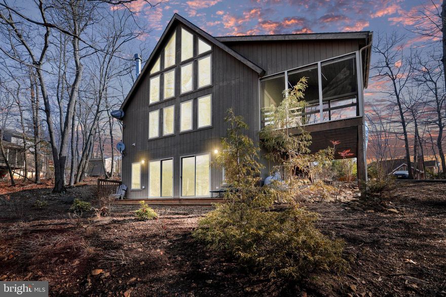 The minute you walk into this lovely Chalet style single family home you will fall in love! Gorgeous 1.02 acre wooded lot with beautiful mountain views! Located on a cul-de-sac street for lots for privacy. Welcoming entry foyer with vaulted ceiling, recessed lighting and wood floor. Updated kitchen with tasteful contemporary wood cabinets, ceramic tiled back splash, breakfast bar with 2 pendants lights, recessed lighting and wood floor. The great room features a cozy gas fireplace, 3 exposed wood beams, fixed glass window wall, and cathedral ceilings. Sliding glass door in dining room that leads to the relaxing 12x12 screened in porch with access to the huge open deck with breathtaking views! You can also enjoy the 8x12 open deck for grilling. There are two guest bedrooms and full bath that completes the main level. Owners loft bedroom features vaulted ceilings/exposed wood beam, lots of windows/fixed glass, walk in closet and en suite bath with skylight, glass block window above the whirlpool tub, and ceramic tiled walk in shower with clear glass doors, The comfortable walk out finished basement includes a haft bath, laundry room, recreation/family room with recessed lighting, 2 windows and 2 sliding glass doors that lead to the open wood deck, unfinished storage room with workshop, great place to enjoy the outdoors with your family and friends. This well maintained home will not be on the market long! Most furniture will convey including dishes, pots, pans, etc.. Class A membership available with a $3150 initiation fee additional.