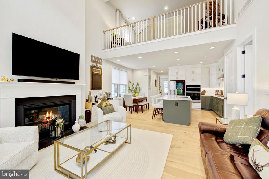 Why wait for new construction when this beautiful, "almost new" home , loaded with upgrades, is available right now?!  An extraordinary expanded townhome in the highly sought after Preserve At Marsh Creek 55+ community has just come to market- and it truly shows better than a model home. This stunning 3 bedroom, 2.5 bathroom corner property offers luxury, comfort and resort-style living at its finest.
Step into the grand foyer and immediately feel the elegance of gleaming oak hardwood floors that flow seamlessly throughout the main level. The modern open concept design features an expanded great room with a dramatic two-story vaulted ceiling, an enclosed gas fireplace, recessed lighting and an impressive wall of windows dressed in custom draperies. Sunlight pours in, creating a warm and inviting atmosphere. Sliding glass doors lead to an expansive stone patio with a paver wall, custom pergola and privacy fencing- the perfect outdoor retreat for barbecues, family gatherings or simply relaxing with a book and soaking up the sun.
The upgraded chef's kitchen is a showstopper, offering stacked wall cabinets with enhanced crown molding, a full custom tile backsplash, a large island that comfortably sits four, Whirlpool appliances,  a built-in wall oven and microwave and a spacious walk-in pantry. The adjacent dining area is ideal for both everyday meals and more formal entertaining.
The first floor primary suite feels like a private spa. Enjoy a sophisicated tray ceiling, a beautiful wall of windows and a luxurious ensuite ceramic tiled bathroom featuring a double vanity with upgraded cabinetry, elegant lighting and an oversized shower with bench seating.  A  large walk-in closet completes this serene retreat. A discreetly located powder room, laundry room and a two car garage with epoxy floor round out the main level.
The second floor offers a beautifully appointed loft- ideal as a living room, office or creative space, (currently being used as a family room and home office.).  Additionally, there are  two generously sized bedrooms featuring plush carpeting, recessed lighting and lots of closet space.  The full bath mirrors the home's refined aesthetic with a double vanity, upgraded cabinetry and designer fixtures.  A custom theater/game room adds a unique touch of luxury and entertainment, making this home truly one-of-a-kind.
Beyond the home itself, the Preserve At Marsh Creek offers an unparalleled lifestyle. The resort-style clubhouse invites you to unwind and connect. Enjoy the refeshing pool, pickleball courts, fitness center, yoga studio, card room and vibrant social calendar. Every day feels like a vacation! 
You have earned the right to live beautifully. Welcome to a home where luxury, comfort and community come together in perfect harmony.  The  Preserve At Marsh Creek- you may never want to leave home again!