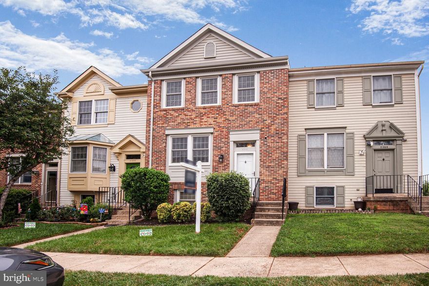 Move-in ready and totally charming, this beautifully updated townhome features over $30K in recent improvements. Enjoy refinished hardwood floors on the main level, brand new carpet upstairs and in the lower level, and fresh paint throughout. The kitchen shines with new quartz countertops and opens to a spacious deck—perfect for grilling and outdoor dining. Newer windows and sliding glass doors provide great natural light and improved energy efficiency. The primary bath includes a new vanity, and updated door hardware throughout adds a stylish modern touch. The finished walk-out lower level offers flexible space ideal for a rec room, office, or potential third bedroom. A fenced-in backyard is perfect for pets or private outdoor living. Thoughtful updates and ample storage make this home a standout. Conveniently located near shops, parks, Routes 7 & 28, and Dulles Airport. Low HOA. Zoned for Rolling Ridge ES, Sterling MS, and Park View HS.