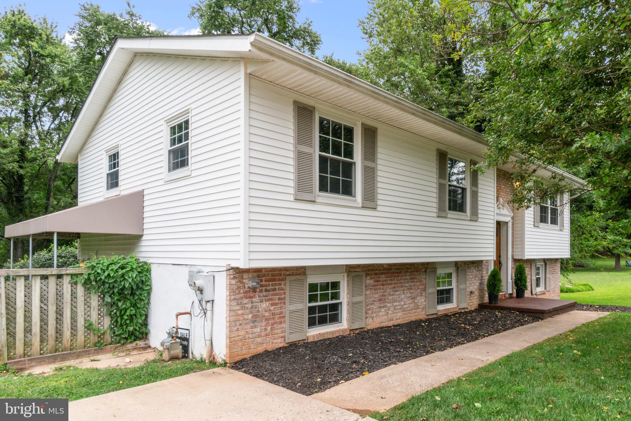 This beautifully maintained 5-bedroom, 2-bath split-level home offers both comfort and convenience in a sought-after location just minutes from the shopping, dining, and entertainment center of Eldersburg. With numerous updates throughout, this home is truly move-in ready.
Step inside to find an inviting open floor plan with refinished hardwood floors (2022) that add warmth and charm to the main living areas. The brand-new kitchen (2024) seamlessly connects to the dining room and living room, and features ample space for cooking and entertaining. Sliding glass doors connect the main living area to the deck with access to the sizable yard below. Down the hall, you’ll find the large, primary bedroom with an ensuite bath, two smaller bedrooms, and a hall bath.
The lower level includes a recently refinished bedroom with durable tile flooring (2023), another bedroom, perfect for guests or an office, and an additional living space, ideal for a family room or a workout area. There is also unfinished space in the basement, large enough to add a third bathroom and increase the home’s value.
Other major improvements include a new HVAC system (2019) and roof (2022).