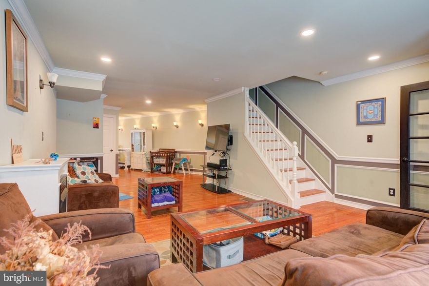 Location, location, location strikes again! 165 Poplar St, situated at 2nd and Poplar, is a beautiful, classic three-story home in the heart of Northern Liberties.   With the impressive property dimensions ( 18 X 67) , this residence features nearly 2,400 square feet of living space, including three spacious bedrooms, 2.5 bathrooms, a large backyard, and a massive third-floor deck. Throughout the home, you will find tasteful, high-end finishes and decor.  The main level opens with a vestibule foyer leading into a living room characterized by hardwood floors, wainscoting, wall sconces, and crown molding. This space includes a gas fireplace and offers ample room for entertaining. The modern kitchen was recently updated to include new countertops and backsplash as well stainless steel appliances including a double oven. Adjacent to the kitchen, the dining area receives significant natural light through a sliding door that opens to a large, fenced-in paver patio and an upgraded, maintenance-free yard, finished with SYNLawn artificial grass. This level also includes a convenient powder room, perfect for hosting.  The second floor offers two large bedrooms, each with impressive custom-fitted closets, as well as a recently updated full bathroom featuring dual sinks and a glass-enclosed shower/deep-soak tub combination. Head up to the third floor where you will find another spacious bedroom, which includes a custom closet and private bathroom with a separate standing shower and large oversized tub.   The third floor space offers tremendous versatility as it can also serve as an ideal guest area, home office, or the primary master suite.  The third-floor landing provides access to an enormous roof deck, perfect for sunbathing and stargazing.   This is a must-see outdoor space!  The basement provides side-by-side laundry and utilities with ample room for storage.  With the high ceilings this is also a great space for exercise / home gym.  The original stucco on the side and back exterior was recently replaced with siding and Hardie Board providing a coastal vibe while you enjoy your backyard and roof deck. An EV outlet was also installed in the front. This home is situated in a fantastic location within walking distance to some of the neighborhood’s and city's best restaurants, including Standard Tap, Jerry’s Bar, Wm. Mulherin's Sons, and Laser Wolf, as well as numerous cafes and shops.  Parking is convenient on this block because both this block of Poplar and the 900 block of New-Market around the corner are permit parking areas.   Often times you will get parking right in front of your home!    With easy access to public transportation and a quick ride to Center City, this home provides both luxury and lifestyle.  Given its unique details and incredible features, this property is truly a must-see.  Easy to show!  Make your appointment today!