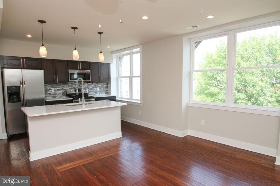 A stunning unit in the Sedgley for rent! All the units in this rehabbed corner property include a wide variety of fantastic finishes and features, including central air, reclaimed pine hardwood flooring, recessed lighting, ceiling fans, high ceilings and large windows for tons of natural light. Enter and discover the large unit with an open and inviting living and dining area, showcasing the kitchen which includes quartz counters, subway tile backsplash and electric stainless steel appliances. The unit also features two light filled bedrooms which include tons of closet space, as well as two tiled bathrooms with quartz counter vanities. Washer and dryer are included in the unit, and bike storage is available in the basement for your comfort and convenience. This pet friendly building is close to universities, hospitals,shopping and public transportation, leaving you just minutes away from Center City.