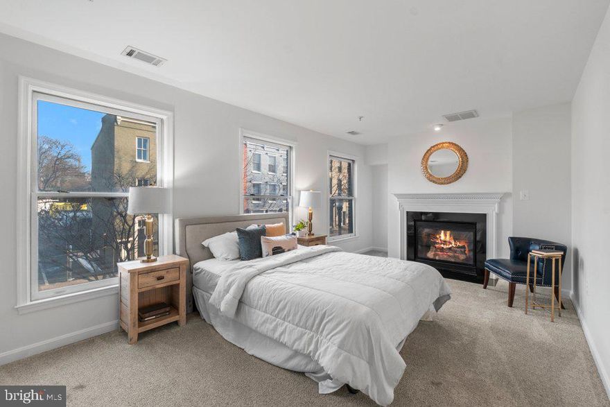 Welcome to the epitome of urban luxury living! This fully renovated 5-story brick townhome nestled in the heart of downtown Frederick, MD, presents an exceptional blend of comfort, style, and convenience.
Step into the inviting main level adorned with gleaming hardwood flooring, where a cozy fireplace sets the tone for relaxation. The well-appointed half bath seamlessly complements the open-concept Kitchen/Dining Room, boasting modern stainless steel appliances and pristine countertops, ideal for culinary enthusiasts and entertainers alike. The second floor unveils the exquisite 1st primary suite, featuring a charming fireplace, abundant closet space, and a lavish new bath, complete with dual vanities, a generous soaking tub, and a walk-in shower, offering a serene retreat after a long day. Traverse to the third floor, where two generously-sized bedrooms await, each accompanied by its own updated bath, providing comfort and privacy for residents and guests. Additionally, find the convenience of a laundry area on this floor, enhancing practicality. Ascend to the fourth floor, where the expansive 2nd Primary suite awaits, boasting an updated bathroom, creating a private haven for relaxation and rejuvenation.
Descend to the thoughtfully designed basement, complete with plush carpeting, a convenient small kitchen/bar, an updated half bath and ample space destined for endless entertainment and leisure.
Outside, discover the convenience of 2 car covered parking behind the house, ensuring both security and ease for your vehicles. Embrace the lifestyle of downtown living with confidence and sophistication, relishing in the premium amenities and modern updates this exceptional townhome has to offer. Don’t miss the opportunity to call this stunning property your home – experience the essence of luxury living in the heart of Frederick’s vibrant downtown scene!