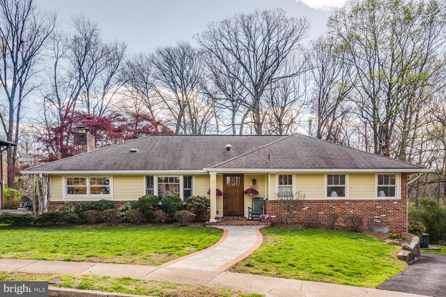 Turnkey, handsome Gene May all brick ranch with level walkout basement in Bellevue Forest is directly adjacent to Gulf Branch Trail & Parkland. Substantial renovation in 2012 combined kitchen, living and dining rooms into open concept space. New stunning kitchen with granite counters, stainless steel appliances, 10 ft long island. Gorgeous hardwood floors, double pane windows, 2 fireplaces. Primary bedroom with en suite bath and two secondary bedrooms plus hall bath complete main level. Downstairs find a beautiful bright daylight walkout basement. Sliding glass doors and a wall of windows exit to huge slate patio. Rear loading 2 car garage with spacious parking pad, updated roof, furnace and CAC.