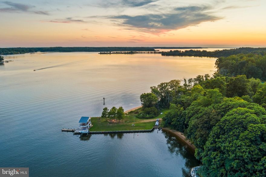 Set on 93 private acres with 6,100 feet of shoreline along the picturesque Sassafras River and Cox Creek.  The estate includes a main house, guest house, pool house and riverside pavilion, offering ample delightful space for large groups to gather, unwind and experience the activities and natural beauty of the upper Chesapeake. Showcasing exceptional design, materials, craftsmanship, the living spaces are framed by expansive views of the Sassafras River. The main residence includes six spacious bedrooms and four and a half baths. The heart of the home is a gourmet kitchen and adjacent generous breakfast room wrapped in 180-degree river views, a setting that enhances every meal. The home flows naturally into multiple large gathering spaces built for entertaining, and into quieter, more intimate rooms designed for reflection and rest. 
The guest house ensures that you can accommodate family and friends.  With three generously sized bedrooms and one and a half baths, full kitchen, fireplace and brick patio, it offers a self-contained retreat that gives guests their own space while keeping everyone together on the estate.
The pool complex redefines what a backyard amenity can be.  At its center is a 52,000-gallon swimming pool with a retractable electric cover, positioned to frame sweeping panoramic river views. An adjoining heated spa and a oversized pool deck complete a setting that invites long, unhurried afternoons in the sun. Elevating the experience further, it offers a full bath, generous living and dining areas, and amenities more commonly found at a high-end resort - a large, well-equipped gym and an eight-person steam room -providing the perfect end to an active day.
Perched at the water's edge, the recently constructed two-story pavilion is the social and recreational heart of the estate's waterfront. It's a front-row seat to everything that makes the Sassafras River so beloved: working crab boats in the early morning, sailboats gliding past at midday, and the sky turning gold over the water at dusk. Spend a lazy afternoon on the pavilion's upper level as the river life unfolds below, then head down to launch your own boat from the private boat lift or boat ramp. The Sassafras and Cox Creek offer boundless activities including  boating, water skiing, tubing, wakeboarding, sailing, paddleboarding, and kayaking, all awaiting just steps away. After fun on the water, return to the pavilion for lunch, dinner, or simply a seat with one of the best views on the upper Bay.
Adjacent to the grassy wharf, the nearly 1,000-foot private sandy beach is a rare and remarkable amenity ideal for an afternoon stroll with friends or a quiet moment watching the sunset or moon rise over the river. Other improvements along the waterfront include a 1000+  stone revetment protecting the shoreline, a 13,000lb boat lift, and a boat ramp.
The grounds reflect a thoughtful balance of beauty, privacy, and long-term stewardship, with carefully planned enhancements designed to complement the natural setting while supporting comfortable estate living. Mature trees and established landscaping create a sense of arrival and continuity across the property, while curated sightlines and open lawn areas transition naturally into wooded edges and surrounding countryside. A network of trails invites exploration through the woods, offering quiet vantage points and seasonal changes that reinforce the property’s connection to the Eastern Shore landscape.
The property's blend of fields, woods and waterfront habitats, complemented by offshore hunting rights offers productive hunting. The land supports healthy populations of deer, wild turkey, ducks & geese, creating a sportsman's haven throughout the seasons.  Enjoy fishing and crabbing from the dock ideally located on the edge of the deep water channel. Major mid-Atlantic cities, international airports & train stations are within easy reach, making the estate accessible for full-time residents and weekend escapes.