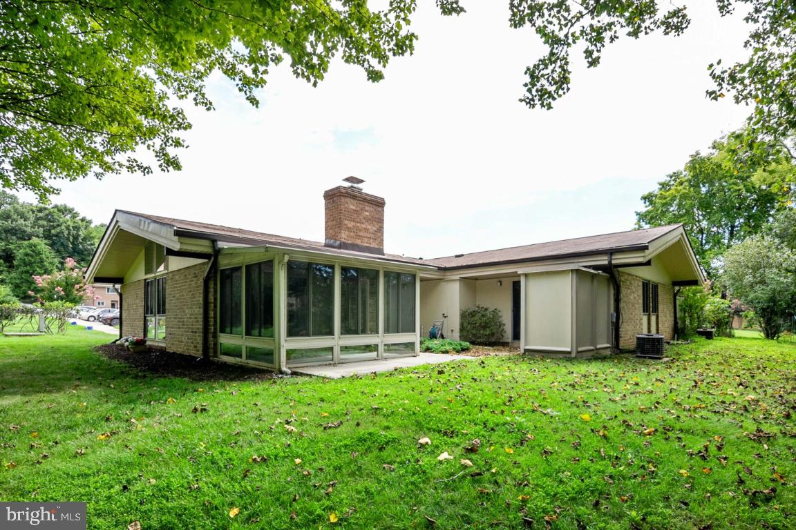THIS IS THE ONE YOU HAVE BEEN WAITING FOR!! Spectacular and rarely available Carvel Patio Home featuring vaulted ceilings with custom tongue and groove woodwork and beams throughout the entire condo.This spacious condo has 2 large bedrooms and 2 full baths with an abundance of closet space. There is a separate laundry area and this home is flooded with natural light with floor to ceiling Paladian windows, a floor to ceiling brick fireplace in the living room, a wonderful eat-in kitchen with large bay window and Lancaster custom built cherry kitchen cabinets and upgraded appliances. A wonderful gorgeous sunroom is located off the living room that overlooks the private patio, trees and stream. Sliding glass doors from the main level bedroom also lead to the patio area and there is a separate shed which is great for extra storage.An assigned parking space is located immediately adjacent to the front door so it is just steps from this wonderful home. The interior of the entire home has just been painted. This is a one of a kind special home!