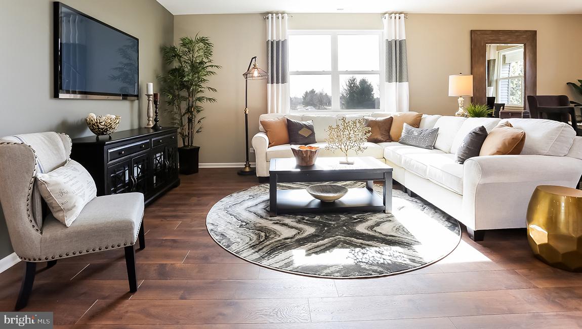 October delivery! Hamilton Walk is Upper Macungie’s newest Active Adult community featuring a gorgeous clubhouse, pool, Bocce court, walking trails, and more. The Clifton by D.R. Horton is a stunning new construction, ranch home plan featuring 1,865 square feet of living space, 2 bedrooms, 2 bathrooms, study, 2-car garage and full walkout basement! With a roomy and flexible floor plan, the Clifton is just as inviting as it is functional! The foyer welcomes you in past a large bedroom, full bath and flex room. The kitchen has plenty of counter space and a large modern island that’s perfect for prep work, dining and entertaining guests. The kitchen opens to the spacious, open great room to be used however best fits your needs and lifestyle. Tucked behind the kitchen is the owner’s suite which features a luxurious bathroom and two large walk-in closets, storage will not be an issue!*Advertised pricing and any current incentives are with the use of builder's preferred lender.