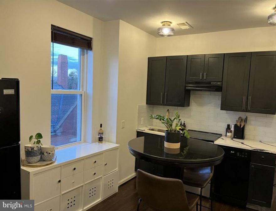 Listed & rented simultaneously on 11/7/23. 2 bedroom with  2 full baths attached (as in a primary bedroom and bath) in Charles Village with a skylight, walk-in closet, wood floors, washer & dryer, central air, window treatments and recessed lights.