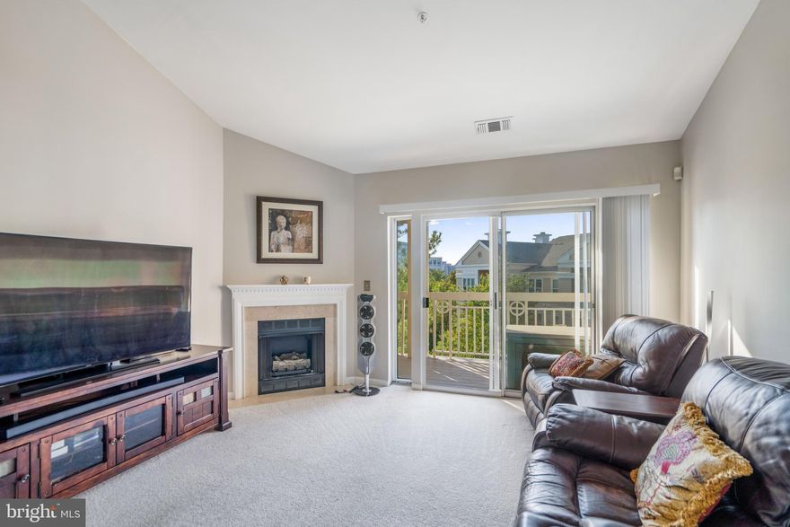 Beautiful 2 bedroom, 2 bath condo ready for tenants!   Partially furnished with furniture you see in the photos.  There is the option to remove furniture not needed by tenant. The condo features a spacious living area w/ gas log fireplace, separate dining area, kitchen with stainless steel appliances, upgraded counter tops and abundant cabinet space.   Also included is a large master bedroom with plenty of natural light, modern master bath, 2nd bedroom and hall bath.  Enjoy the outdoors and view of the gardens and pool from the balcony.  Stacked washer/dryer in the unit.  One assigned garage parking space is included at no extra cost.  Move in fee is required.  Easy, close access to the Dulles Access Rd and Fairfax County Pkwy.  Perfect location for tenants that need a close proximity to Dulles Airport.   Less than a mile from a metro stop.  Great for commuters to Washington DC, Fairfax and Loudoun counties.   Multiple grocery stores and restaurants are close by.   The amenities include 2 outdoor pools, exercise room and clubhouse.