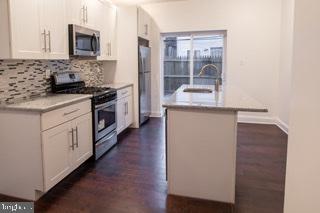 Well kept home with all the bells and whistles that s walking distance from Center City. It just needs your personal touch.