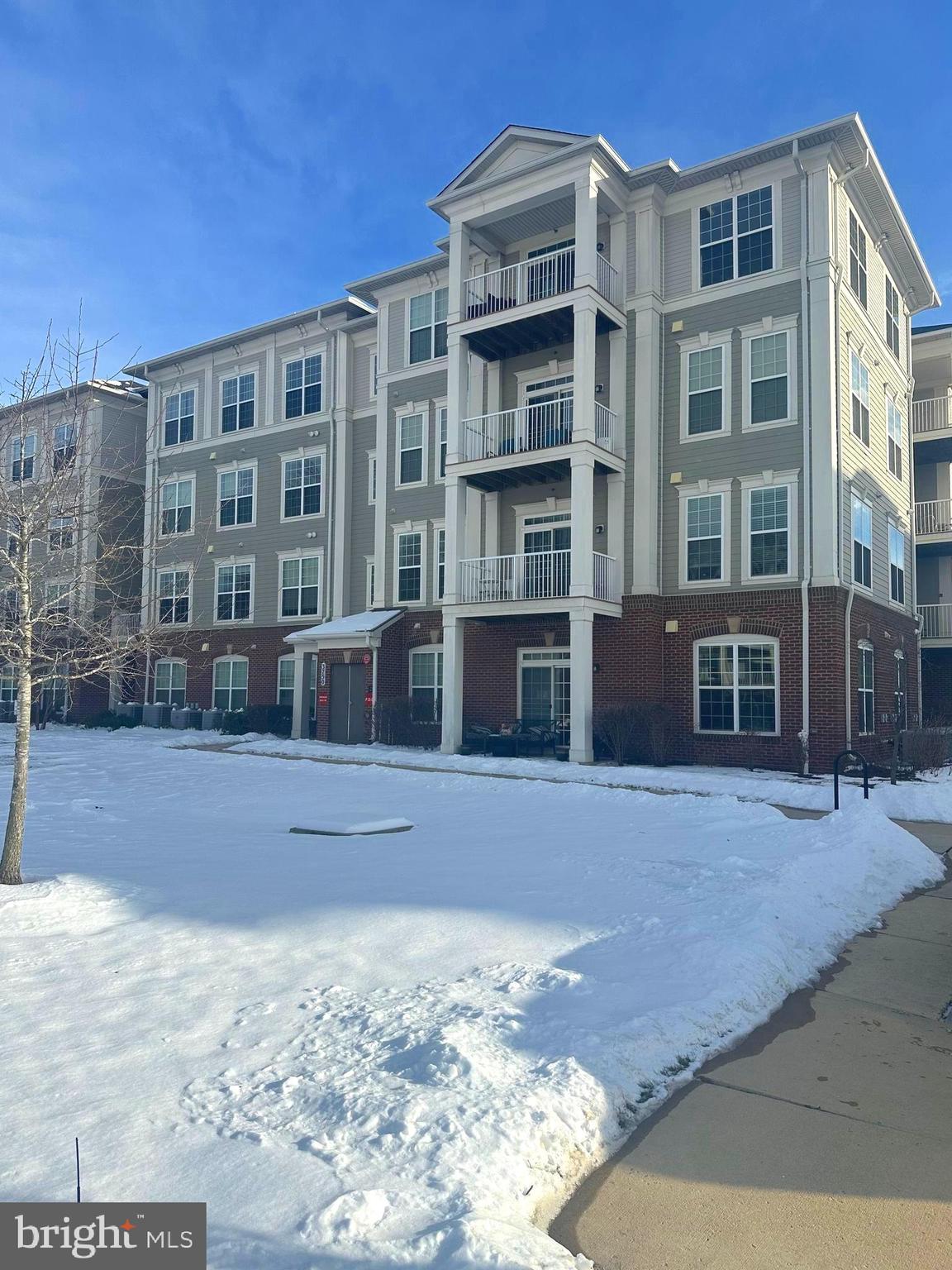 Welcome to this beautifully appointed 2-bedroom, 2-bath condominium, ideally located in the desirable Norbeck Crossing community. This meticulously maintained unit features a gourmet kitchen with stainless steel appliances, a gas range, elegant granite countertops, 42" cabinets, and a spacious kitchen island—perfect for both cooking and entertaining.
The open-concept layout offers a seamless flow between the living and dining areas, providing a bright and inviting atmosphere. The luxurious owner’s suite boasts an en-suite bathroom with ceramic tile flooring and a large walk-in closet, creating a true retreat.
Additional highlights include a private garage, ample storage space, and the convenience of an in-unit full-size washer and dryer. Step outside to your private balcony and enjoy the surroundings. The building also offers plenty of unassigned parking spaces and a luxury elevator for easy access.
Situated in the highly sought-after Norbeck Crossing, this unit is a rare find. The community features a scenic walking and biking path that leads directly to East Norbeck Local Park & Playground. Enjoy easy access to public transportation, Park and Ride options, and major roadways, including Georgia Avenue, MD-200 (ICC), and I-95. Commuters will appreciate the short 4-mile drive to the Glenmont Metro Red Line, as well as the proximity to shopping destinations in downtown Silver Spring, Rockville, and Olney.
This prime location offers the perfect balance of convenience, luxury, and comfort—schedule a tour today!