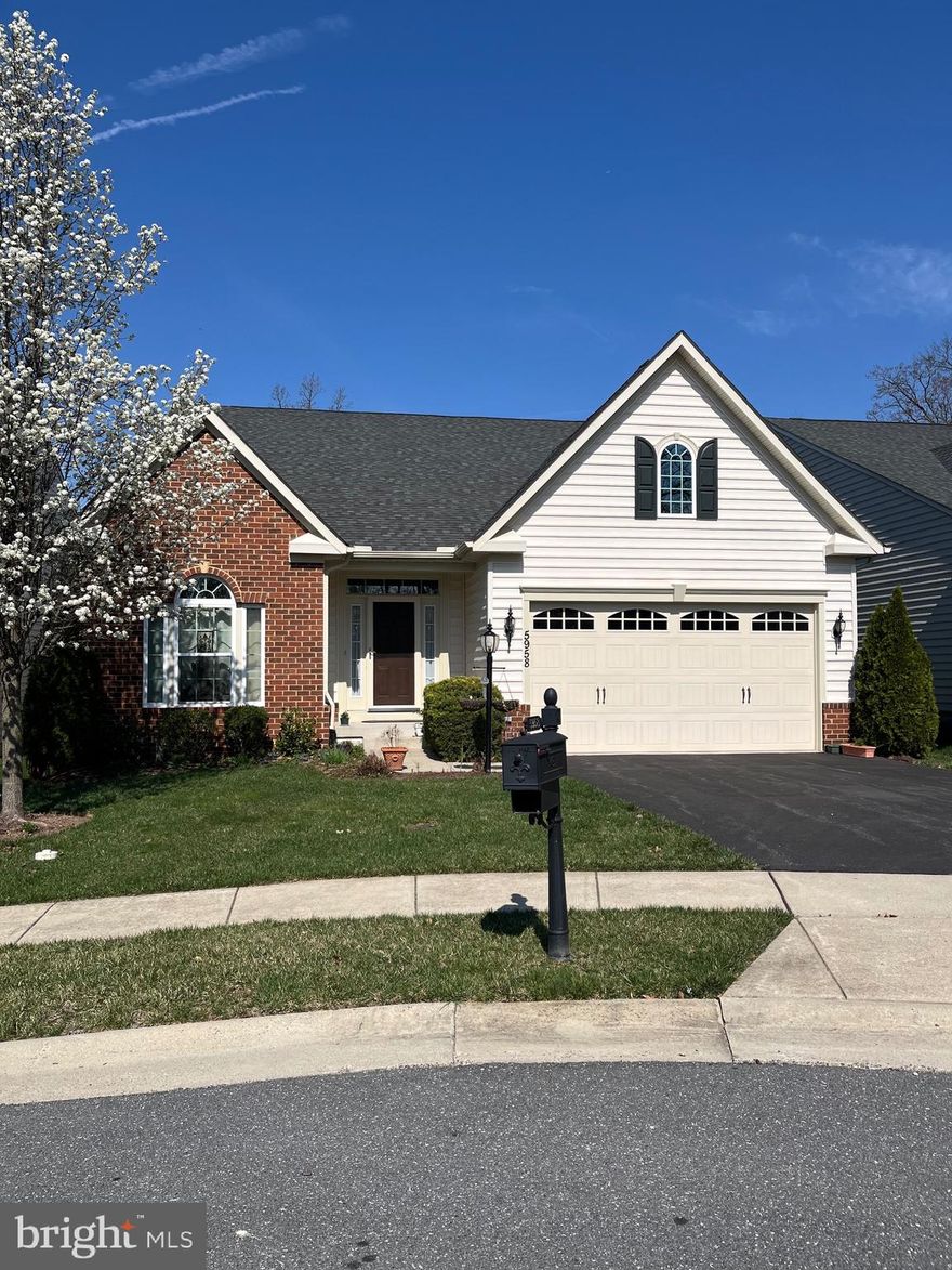 This detached home is the Castleton model.  There are only a few of these models in this sub-division.  This move in ready home features main level living.  Beautiful hardwood floors on the main level and even the primary bedroom.  Main level features:  Living room with gas fireplace that exits onto deck backing to tree.  Large kitchen with center isle and breakfast room.  Gas cooking and granite counters.  Separate dining room with tray ceiling, main level office, which could also be another living room, laundry room, large primary suite with luxury full bath, tiled shower and double sinks.  2 additional bedrooms are also on the main level.  This home is bright and open with lots of natural light.  The finished lower level offer a family room with fireplace, bathroom, game room/exercise room and bonus room.  The association maintains the lawn which includes mowing, trimming, mulching, snow and more.  The club house has a large meeting room, exercise room, kitchen, game room, and outdoor pool.  Great community and minutes to major highways and shopping.