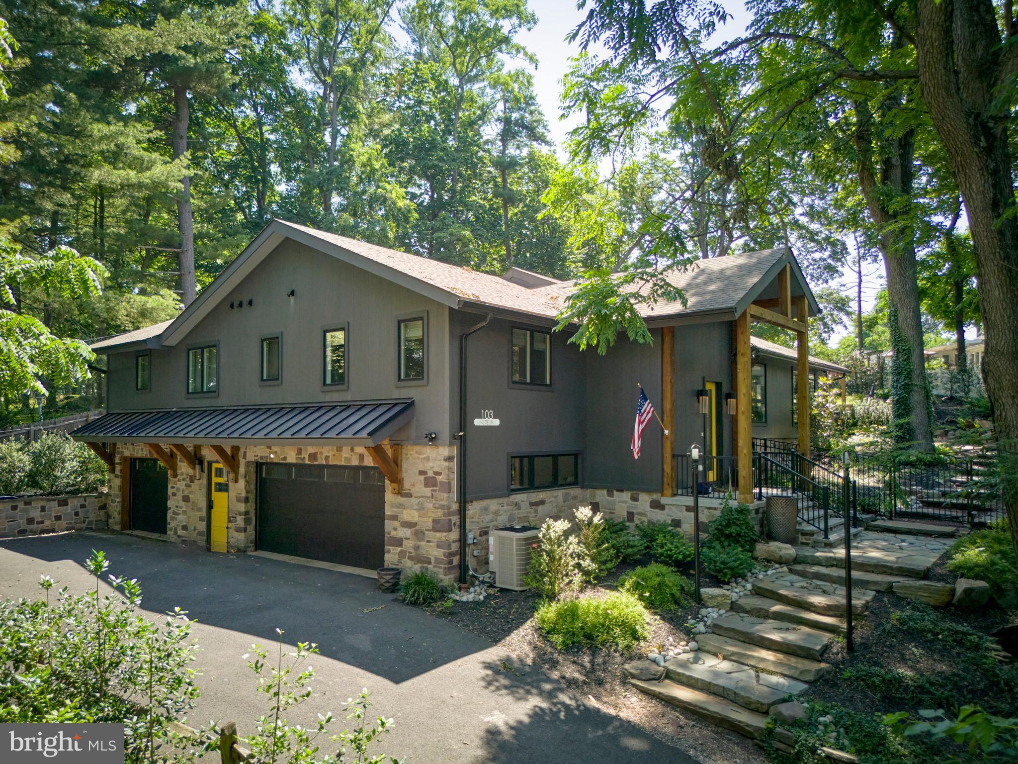 Welcome to your dream residence — a complete, high-end renovation blending modern farmhouse charm with timeless elegance. Stepping through the dramatic foyer, you’ll be greeted by marble tile, exposed stone, soaring vaulted ceilings, and light that pours into the formal living room, showcasing a floor‑to‑ceiling gas fireplace flanked by sleek built-ins and electric shades. Entertain in style in the open-concept dining and living space, flowing effortlessly into a chef-inspired gourmet kitchen. Equipped with premium Miele appliances — including a 5-burner gas cooktop, steam oven, double ovens, wine fridge, stainless farm sink, coffee bar, pantry, and custom banquette — this kitchen is as functional as it is gorgeous, with a striking quartz island and herringbone tile backsplash .
The private bedroom wing is accessed through an elegant barn door. Retreat to the main suite featuring vaulted ceilings, deck access, a spa-like ensuite with radiant-floor heating, dual oak vanities, soaking tub, and a shower for two. Two additional vaulted bedrooms share a tastefully appointed full bath. A stylish laundry room and formal powder room complete the main floor .
The lower level expands your living space with a family/entertainment area, original stone wood-burning fireplace, built-in media, two Miele wine fridges, wet bar, and full bath — ideal for gatherings or downtime. Car aficionados will appreciate the spacious 3-car garage, including a third bay for storage or workshop needs. No detail overlooked — upgraded HVAC, plumbing, electrical, windows, doors, water softener, dehumidifier, and full-house generator ensure peace of mind
Step outside to your private oasis — a terraced, fenced yard with professional landscaping, a bluestone patio under a pergola, gas fire pit, and spa — perfect for both intimate evenings and al fresco entertaining.
All this within walking distance to New Hope’s award-winning restaurants, boutique shops, the Bucks County Playhouse, and the scenic Delaware River.