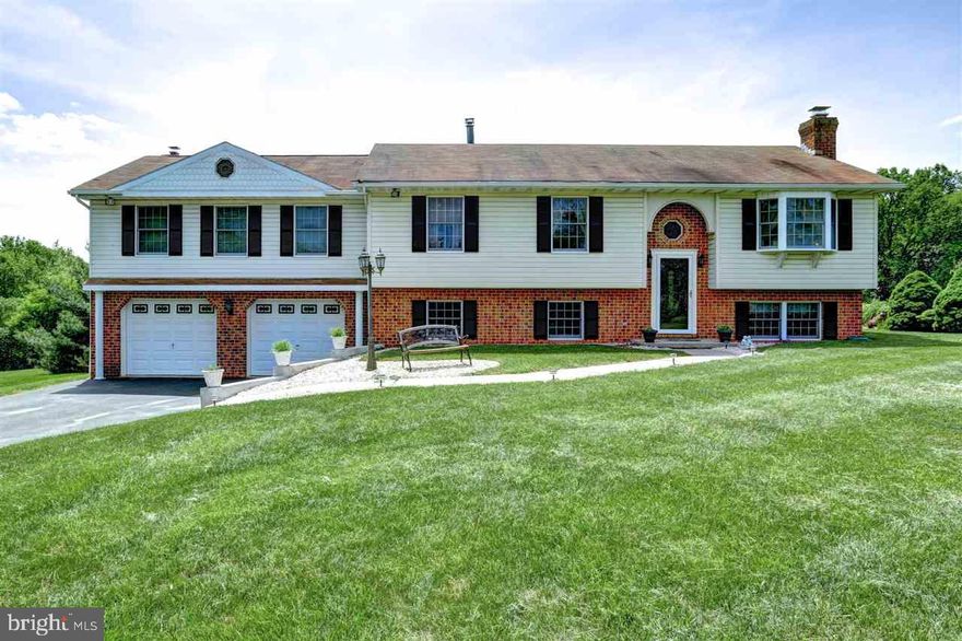 Tranquil Country Setting! Come check out this spacious raised ranch on over a half acre lot.  Featuring a formal living rm and a custom EIK with a two dimensional oranmental fireplace & access to the deck. The MBR features cath ceiling, wood fireplace, huge walk-in closet, full bath, Jacuzzi tub + sitting rm. The finished lower level includes a walk-out, wood fireplace, full bath & the  optional 4th bedroom. Oversized 2 car garage! USDA eligible