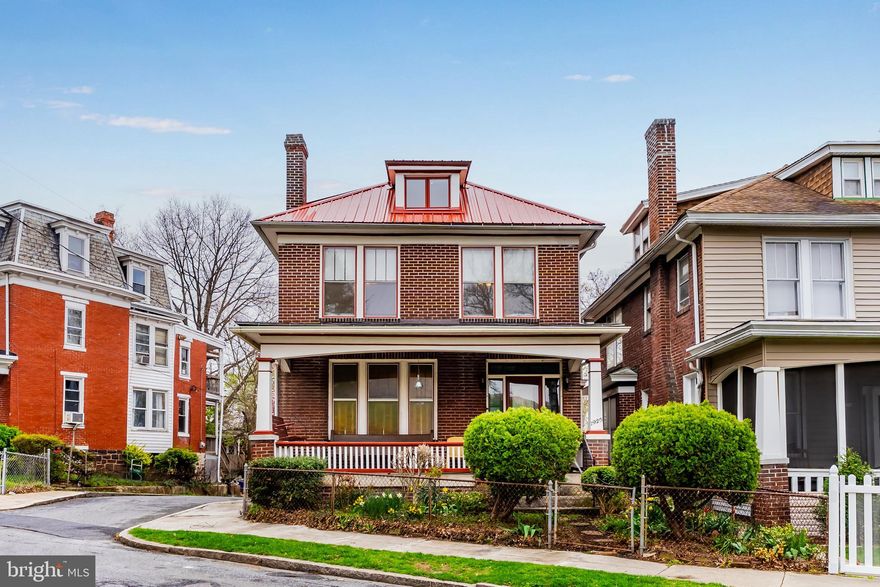 Character and charm define this very well kept and long term owner home.  So much history to this home, natural woodwork, beveled glass, architecture , carvings in the staircase and original hardwoods are just some of the charm you will find in this stately home. There are 4 BR's, 2 full BA's and 2 half bath's, of which the 3rd floor is the primary BR, that is very generous in size w/ cute cubbies . An enclosed balcony off of BR#3, is perfect for reading, studying or just enjoying the quiet. The full front covered front porch is ideal for gatherings and conversations.  This solid brick home is a staple in this neighborhood, on the corner and walking distance to the park.  You will love all of the custom built-ins that just add to the character of this home.