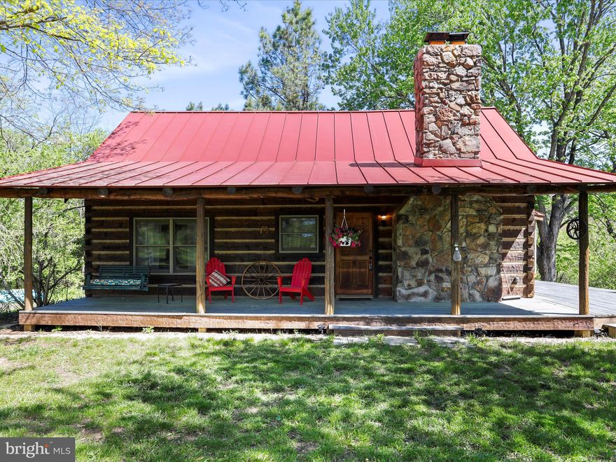 Welcome to Blue Meadows, just outside the quiet, historic community of Green Spring, West Virginia, in the heart of Hampshire County. This isn’t just another piece of land. This is 7.18 acres of solid, usable ground with 192 feet of deep water frontage on the South Branch of the Potomac River. Property like this doesn’t hit the market often—land that gives you direct river frontage, privacy, room to move, and the kind of outdoor lifestyle most folks only dream about. At the center of it all is a 1,764 sq. ft. log home that’s the real deal. Three legit bedrooms and two full bathrooms. Towering ceilings that make the whole place feel even bigger, anchored by a massive stone fireplace where you’ll relax after a day outdoors or out on the river. The home’s capped with a brand-new metal roof—built to handle whatever Mother Nature dishes out for years to come. Step outside and the perks keep coming. A wrap-around porch for your morning coffee or evening bourbon. A rear deck with enough room for family and friends. And a dedicated BBQ area complete with a custom brick pizza oven—perfect for cooking up whatever you pulled from the river or just enjoying time with the people who matter. There’s also a detached one-car garage with plenty of space for your truck, boat, ATVs, and every tool you’ll ever need. The land itself? Perfect. Gently rolling terrain ready for whatever you want to throw at it. Fishing, kayaking, or just kicking back and taking in the peace and quiet. You’ll enjoy the sights and sounds of nature in every direction—without the noise and hassle of city life. Best of all, while you’ll feel like you’re miles from anywhere, you’re really not. Just 2.5 hours from Washington, D.C., Baltimore, and Northern Virginia. Far enough to escape the traffic and stress, but close enough to make the trip back if you absolutely have to. And while the demand for quality riverfront property is only going up, you won’t find another opportunity like this anytime soon. It’s more than a home. It’s a legacy. A place you can hand down for generations. Whether you’re after a weekend getaway, a family retreat, or a full-time home, this property delivers. Land. Water. Freedom.