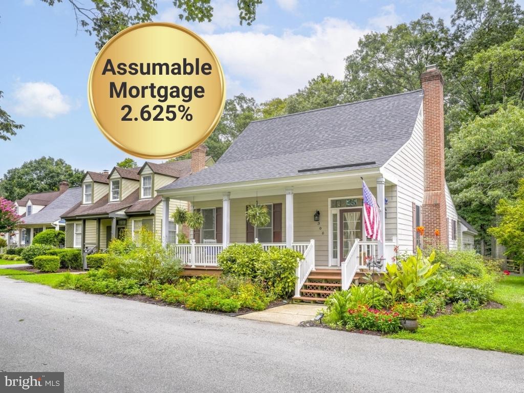 **Assumable 2.625% Rate Loan (terms/conditions apply)**. You’ll find charm, character, and opportunity at 300 Hickory Circle, a cheerful 2-bedroom, 2-bath carriage house in the sought-after Hickory Ridge community. The developers built this as the original model home on a preferred lot location and the current owners have filled it with thoughtful upgrades and an enchanting garden. With 1,526 sq ft of well-designed, one-level living on a 0.2-acre lot backing to forest, this home offers space, privacy, and a chance to expand. Move through the light-filled foyer into a spacious great room with soaring 10’ ceilings and laminate flooring (installed in 2023). The updated kitchen includes stainless steel appliances from 2024—refrigerator, microwave, and dishwasher—and ample counter space for a coffee bar, plus a breakfast nook that flexes easily as an office, play space, or sitting area. The generously sized primary suite and second bedroom both feature walk-in closets and wide-louvered plantation shutters. The owners renovated both bathrooms in 2024 with style and care. The laundry room—complete with washer and dryer that convey—also serves as a mudroom with direct access to the two-car garage and shaded back patio. The home’s layout keeps everything on one level, and the owners added grab bars for enhanced mobility. A pull-down attic provides access to a fully roughed-in second floor—adding square feet of opportunity. The owners laid the subfloor, roughed in plumbing and electrical, and replaced the gables. Just add stairs to finish this level into extra bedrooms, a media room, home gym, or whatever fits your needs. Outside, the covered front porch offers space for rocking chairs and overlooks lush landscaping that blooms across all four seasons. In the fenced backyard, enjoy a professionally hardscaped patio and grilling area (2022) with upgraded drainage and grading. A garden shed adds convenient storage. The owners have invested in key improvements over the past four years, including: new roof (2024), new kitchen appliances (2024), renovated bathrooms (2023), wood-burning fireplace with custom stone hearth (2022), interior garage stairs (2025), street-line piping replaced, backyard fencing and hardscaping (2022), updated flooring (2022), and seasonal garden landscaping. The Hickory Ridge HOA covers lawn care and snow removal in unfenced areas and offers access to the neighborhood playground. While this isn’t a 55+ community, the property taxes run lower than many age-restricted neighborhoods nearby. You’re just minutes from downtown La Plata, schools, shops, restaurants, and parks. This home isn’t just a place to live—it’s a space to grow, both inside and out. Come see why 300 Hickory Circle stands apart from cookie-cutter homes. Please allow one hour’s notice for showings.