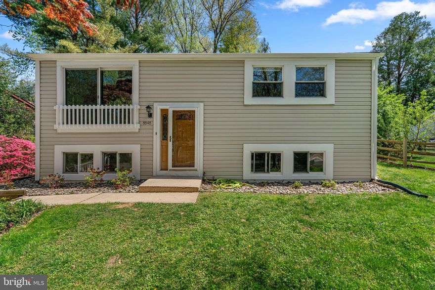 Beautifully upgraded and exceptionally private split-foyer residence offering 4 bedrooms, 2 bathrooms, and 1,599 finished square feet, featuring a flexible layout designed for modern living, nestled on a low-traffic cul-de-sac in picturesque Phelps Luck with close proximity to tranquil water views and scenic surrounding trails. Seamlessly combining a serene, nature-filled setting with everyday conveniences and thoughtful upgrades throughout, this home delivers both comfort and lifestyle appeal. // A bright and airy interior is bathed in natural light. Step inside the welcoming foyer with ceramic tile flooring and ascend to the open-concept main level, enhanced by energy-efficient sun tunnels and expansive windows that flood the living room with sunlight. Durable laminate flooring flows effortlessly into the dining area with direct deck access, creating an ideal space for both everyday living and entertaining. The modernized, eat-in kitchen is both stylish and functional, featuring stainless steel appliances, a two-tiered island with breakfast bar seating, recently updated premium quartz countertops, crisp white shaker-style cabinetry, and laminate flooring, all complemented by clear sightlines into the main living areas for seamless flow. The main level hosts a spacious primary bedroom and a second well-appointed bedroom, both with laminate flooring, along with a full bathroom designed with comfort in mind. // The fully finished lower level offers LVT flooring throughout and expands the living space with an incredible recreation room—perfect for movie nights, a home gym, or a dedicated play area—alongside two beautifully finished and private bedrooms ideal for a home office or guest accommodations, plus an additional full bathroom. // Enjoy outdoor living on the expansive deck overlooking a fully fenced backyard that backs to tranquil woods, providing a peaceful and private retreat. // Ideally located with endless nearby outdoor recreation, this home is just steps from Columbia’s expansive vehicle-free pathway system, Lake Elkhorn, and Jackson Pond, with direct access to the surrounding Columbia trail network. It is also conveniently minutes from shopping, dining, and entertainment, including The Mall in Columbia and Merriweather Post Pavilion, as well as major commuter routes such as MD-32 and US-29.