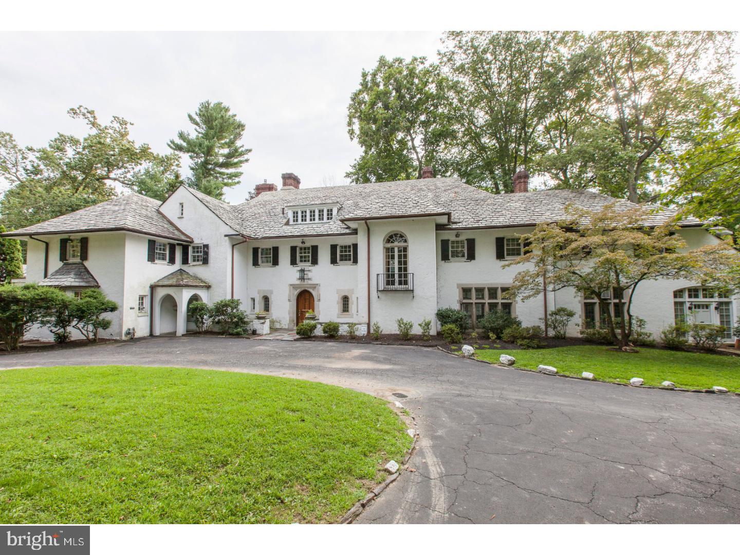 Unique property in the estate area of Wynnewood, built in 1927 with all of the special features of that era. A circular driveway leads to the massive front door opening into a tile Foyer with a Powder Room on each side. The extra large Living Room has a stone Fireplace and French doors leading to the terrace. Step down from the Living Room to the Sitting Room with f/p, from there to the Library with f/p, walls of shelves, and a domed ceiling, then into the Sun Room with a powder room. To the left of the l.r. is the Dining Room with f/p,and French doors opening onto the Breakfast Room. There is a Butler's Pantry, a large Kitchen, Laundry Room and p.r. A curved stairway off of the living room leads to the second floor. The large Master Bedroom with f/p has a Master Bath with dressing area and built-in closets. There are two Bedrooms with a connecting Bath, and two Bedrooms with a hall Bath. Off of the back stairs there are three other Bedrooms, a Sun Room, two Baths and a room with 5 cedar closets, and access to the elevator. The third floor Family Room with built-in storage benches,has a vaulted, beamed ceiling. There is a cedar closet, two rooms plus large attic storage spaces. From the main set of basement stairs, there is a Recreation Room with f/p and a wine cellar. The other set of basement stairs leads to storage rooms. The first floor has a separate service entrance with access to the elevator and a hall between the kitchen area and the main living area. There are two security systems with outside cameras. Three additional parcels are included, the lot size, taxes, and assessments are the combination of all four parcels. The pool and pool house are on one of the parcels. The house is Class 2 historically registered in Lower Merion Township. This property is being sold in as-is condition.