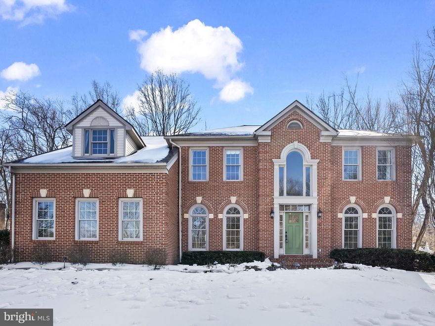 Welcome to this exceptional 4-bedroom, 4.5-bath estate offering nearly 5,900 square feet space on almost one acre in the sought after Tall Oaks Neighborhood. The home features a bright, airy layout with beautiful sight-lines from the upper level overlooking the living room and main hallway, allowing natural light to flow throughout.
The gourmet kitchen with breakfast area provides an inviting space for casual dining and daily living, while remaining distinct from the main living room, offering both functionality and separation for entertaining. Just off the kitchen, step out onto a deck overlooking the flat, usable backyard, creating the perfect setting for outdoor dining, relaxing, and entertaining.
The expansive level backyard offers endless possibilities—ideal for gatherings, play, gardening, or simply enjoying the outdoors in a peaceful setting.
The luxurious primary suite serves as a private retreat, featuring a spacious bedroom, dedicated seating area, and a newly remodeled spa-inspired primary bathroom (2026).
The fully finished basement is an entertainer’s dream, complete with a wine tasting room, full-size bar, and flexible living space with potential for an in-law suite—ideal for guests or multigenerational living.
Recent upgrades include fresh paint in the dining room, office, and basement (2026), new powder room vanity (2026), septic drainage fields replaced (2022), full HVAC replacement with conversion to electric heat (2022), roof replacement (2018), and garage door opener replacement (2025).
 Conveniently located in Southern Anne Arundel County, enjoy easy access to local marinas, shopping, and commuter routes. A rare opportunity to own a spacious, well-maintained home offering elegance, comfort, and versatile indoor-outdoor living in a serene setting.