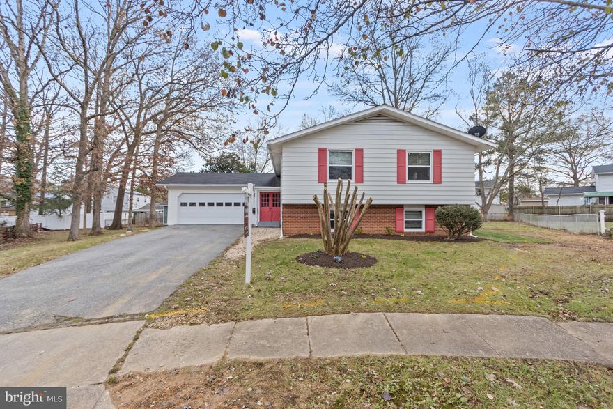BUYER'S FINANCING FELL THROUGH! HERES YOUR SECOND CHANCE! Welcome home! A great, low priced, updated home in Lanham, waiting for you! This deceptively large home has been updated with paint, new cabinets, recently replaced appliances, new garage door, updated bathrooms and more! On the upper level, you are greeted with a large living room, living room, kitchen combination open floor plan with abundance of natural lighting flooding these rooms. Throughout the main level this home, you are able to enjoy recessed lighting, original hardwood flooring throughout most of the house, and a wood burning fireplace for those cold, cozy nights. The upper level also includes 3 full bedrooms, and 2 full bathrooms with an owner's en suite. The lower level, one will be able to enjoy an additional full bedroom plus a den that could function as a 5th bedroom (with windows), storage, or an office and full bathroom plus a rec room area with wood burning fireplace and plenty of storage for all of ones belongings. On the exterior, a two car garage a large, flat rear yard for all of your outdoor experiences, as well as privacy with plenty natural trees and location at the back of the cul-de-sac. 

This could be the perfect starter home or the perfect upgrade home. One can reimagine this home right away with equity in place, or simply move in and upgrade this home as time goes on. This is a great option for you to call home! Just a short drive to the greenway shopping center, Seabrook metro station (walking distance), and 495. Low inventory in the marketplace right now, hurry before its too late! Schedule a showing today!