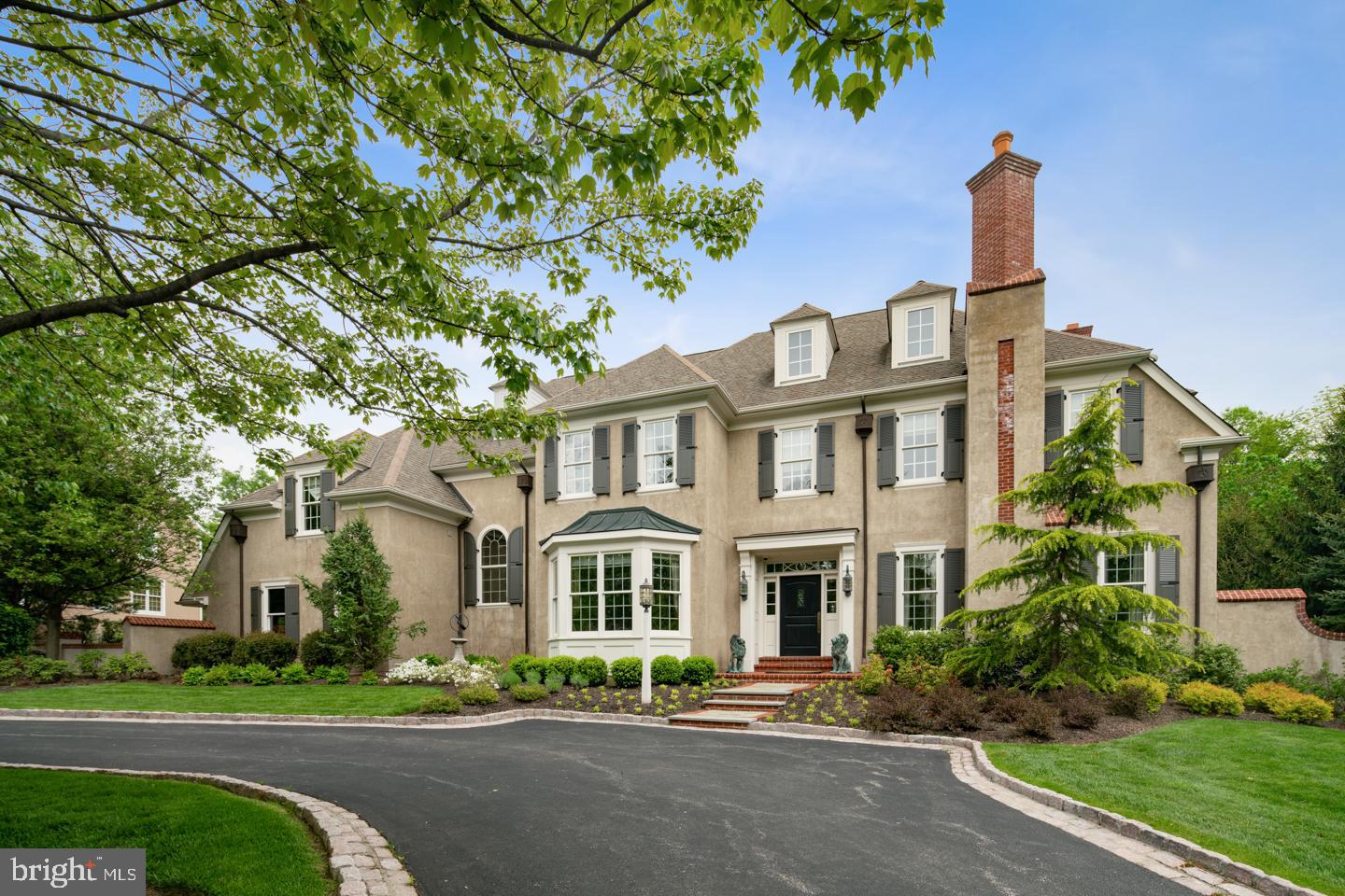 Welcome to this Grand Manor home in Harriton Farms, northside Bryn Mawr, the heart of Lower Merion Township. Better than new, this home was built by renowned, and widely respected, Main Line builder, Don Pohlig in 2006. Elegantly designed, every last detail of this home has been meticulously and thoughtfully considered to provide a luxurious lifestyle and modern living experience. Stately positioned on a level lot with mature specimen trees and a circular driveway, with a backyard that could easily host the pool party of your dreams alongside the generous flagstone patio. Enter this center hall colonial, and be greeted by the airy and elegant foyer graced with handsome archways, fine millwork and a sweeping staircase. The first floor offers a formal living room which has been very interestingly designed as a lounge with a custom wet bar, and a romantic gas fireplace. This is not the typical unused living room space, it is super inviting, your guests will want to spend time enjoying it! A formal dining room with picture window, flows to the butler's pantry with wet bar and wine refrigerator. First floor includes a study with custom built in cabinetry and gas fireplace, a chic powder room ready to wow your guests! The eat-in chef s gourmet kitchen features unique stone countertops, a professional 48 Thermador gas cooktop, Sub Zero refrigeration, and Miele double wall ovens. Open to the kitchen and perfect for entertaining is the family great room with cathedral ceiling and gas fireplace. A mud room with second powder room, cubbies and generous closet space, and entrance to oversized three car garage. As you follow the grand sweeping staircase to the second floor, it leads first to the master bedroom suite. The master includes a tray vaulted ceiling, a dressing area with his and her closets, a bath with soaking tub, water closet, and stall shower. Opposite side up hallway you will find four additional bedrooms, two with private en suite baths and two with adjoining Jack and Jill baths. All bedrooms have abundant closet space. Third floor houses a walk up attic able to store almost anything, as well as mechanicals. A finished daylight basement with an additional full bath, plus a wine cellar, provides additional living space.Elan home automation sysytem, The home is a show stopper and offers many other details not mentioned. A true must see! Sellers are motivated. All reasonable offers will be considered. Taxes estimated to be below $30,000 once appealed. Seller will credit buyer difference between current taxes and estimated appealed amount for 2019 and 2020.