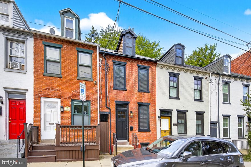 Welcome to 110 N Plum Street, a charming 3-story Lancaster City rowhome that perfectly blends historic character with modern updates. Built in 1880, this home showcases timeless details like original wood floors and an exposed brick wall in the family room, paired with contemporary touches such as a bright updated kitchen with butcher block countertops, stylish finishes, and newer mini-split systems for year-round comfort. Offering 1.5 baths, including a tiled bath surround on the second floor, plus the convenience of first-floor laundry, this home feels both functional and inviting. With its chic aesthetic, natural light, and desirable east side location known for walkability, 110 N Plum is a true city gem.