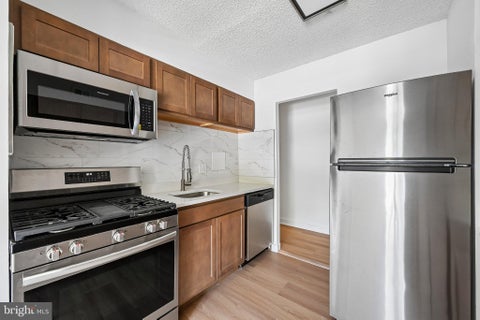 Photo of 5911 Tamar Drive #8, COLUMBIA, MD 21045 (MLS # MDHW2073882)