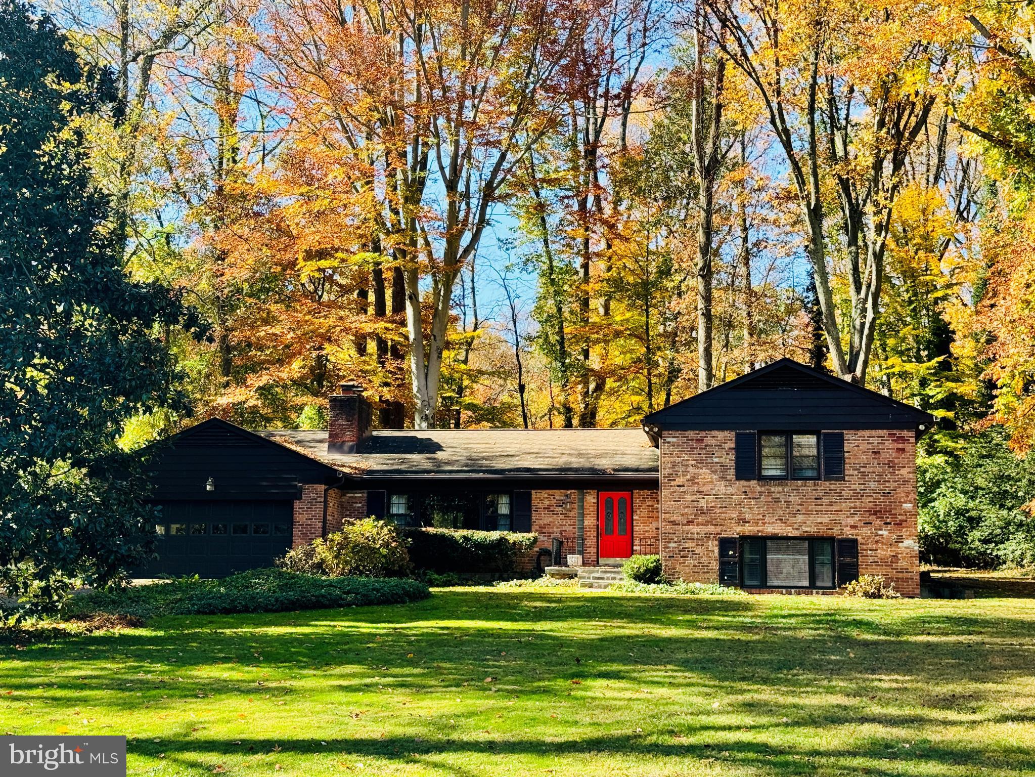 Quality-built all brick split-level home on 0.71 acres in Mantua. Over 3,750 finished square feet. this home is situated in a prime location in the neigbhorhood; a beautiful street comprised of larger lots and just a few yards from the entrance to Eakin Park. Tastefully updated throughout and well maintained. Kitchen is open to gorgeous family room addition that is full of natural light and custom built-in shelving, as well as a wood burning stove. Separate banquet size dining room. Elegant living room with wood burning fireplace. Spacious bedrooms and updated baths on upper level. The primary suite has a delightful sitting area and custom built in cabinets. The updated primary bathroom has double sinks and a large soaking tub, new quartz countertop. The recently renovated hall bathroom has double sinks also. Huge rec room on lower level with walk up door to side. Wood burning fireplace and a wall of custom cabinets as well as a built in desk area. This lower level contains a third full bath, laundry room and a large 4th bedroom/guest suite. This home is a rare offering on a beautiful level lot fringed by trees. The exterior flagstone patio looks over an expansive lawn area and is a nature sanctuary full of birds and wildlife. Trails and park nearby- Eakin Park has 2 public tennis courts, basketball court and tot lot. Mantua Swim and tennis club within the neighborhood has active adult and kid swim and tennis programs plus pickle ball! This home has a membership that is available for purchase to the buyer - avoid the long wait list. Woodson HS. Close to Mosaic shopping center, Fairfax Hospital, Beltway access and major highways. Dunn Loring and Vienna Metros close by. Open House Saturday 3/22 2-4 pm